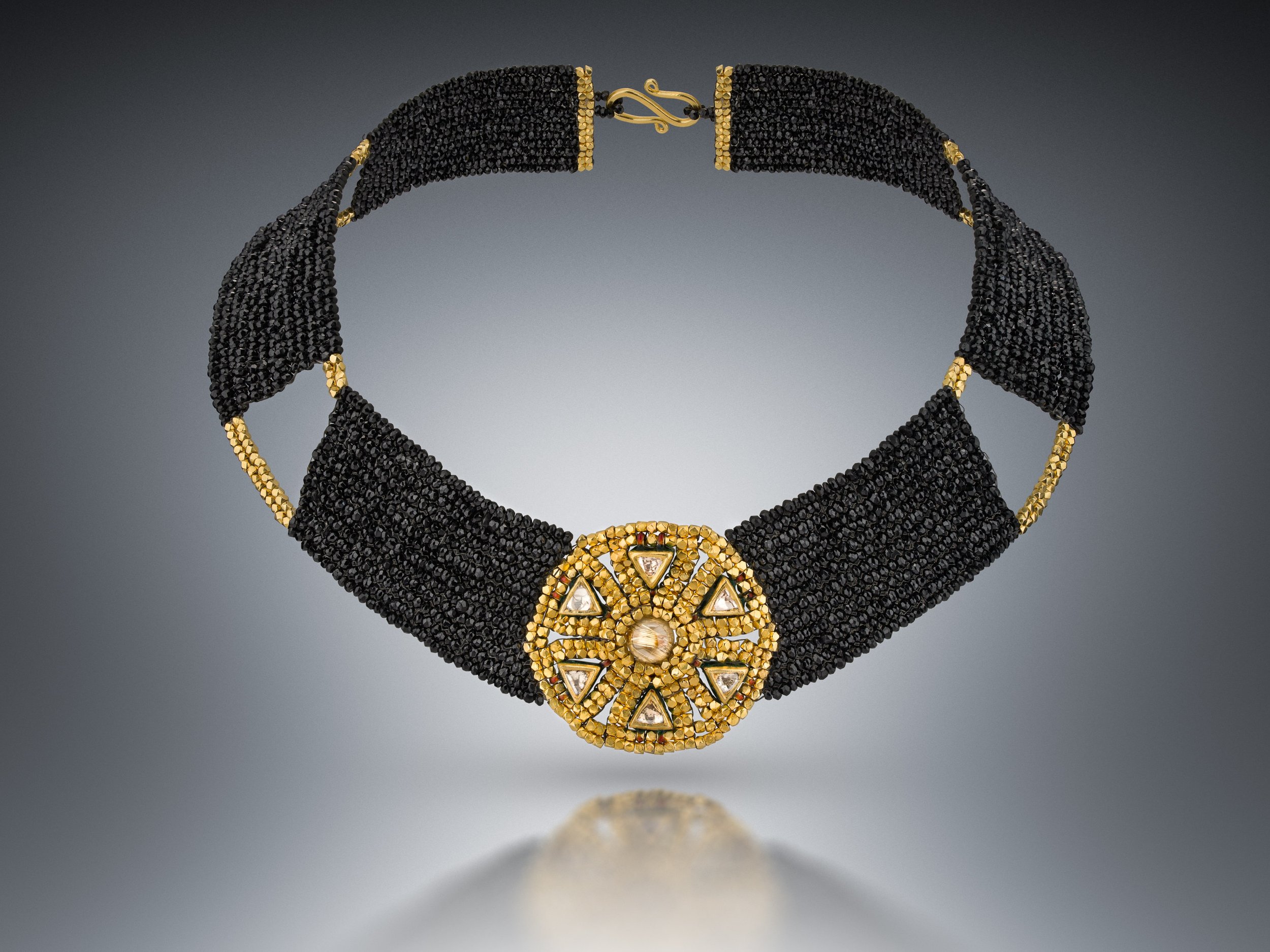 Ancient Choker.   Entirely hand woven from black spinel, and 18k gold beads, this choker is enhanced with diamond and gold charms from India.