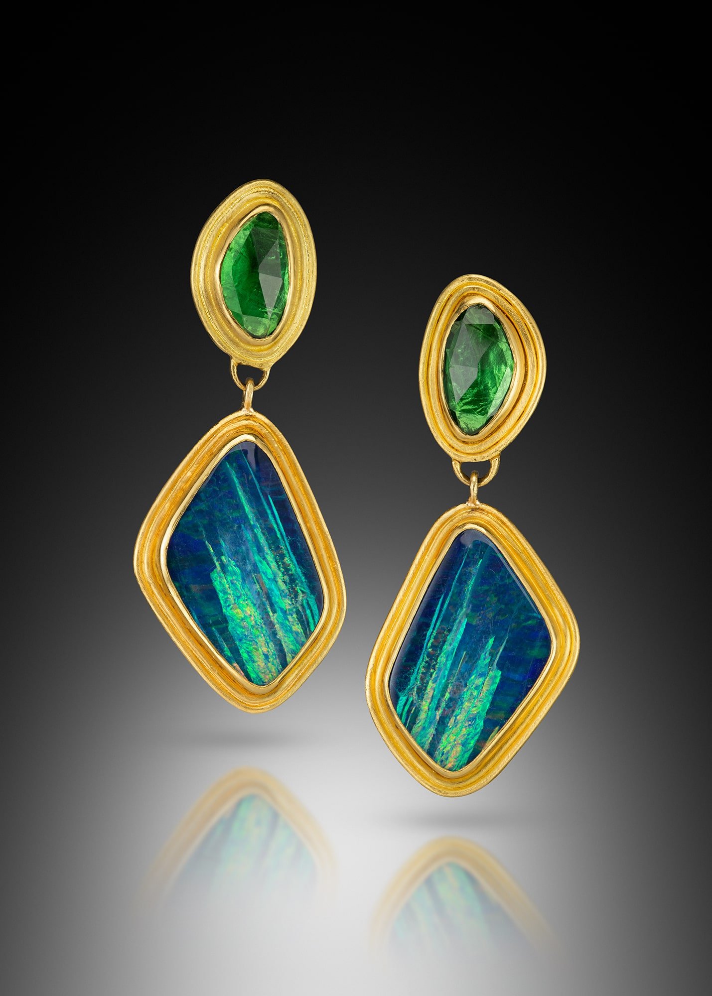 Opal and Tsavorite Earrings.   These long earrings are hand fabricated, and fused in 22k gold.  They are set with Australian opals and rose cut tsavorites.