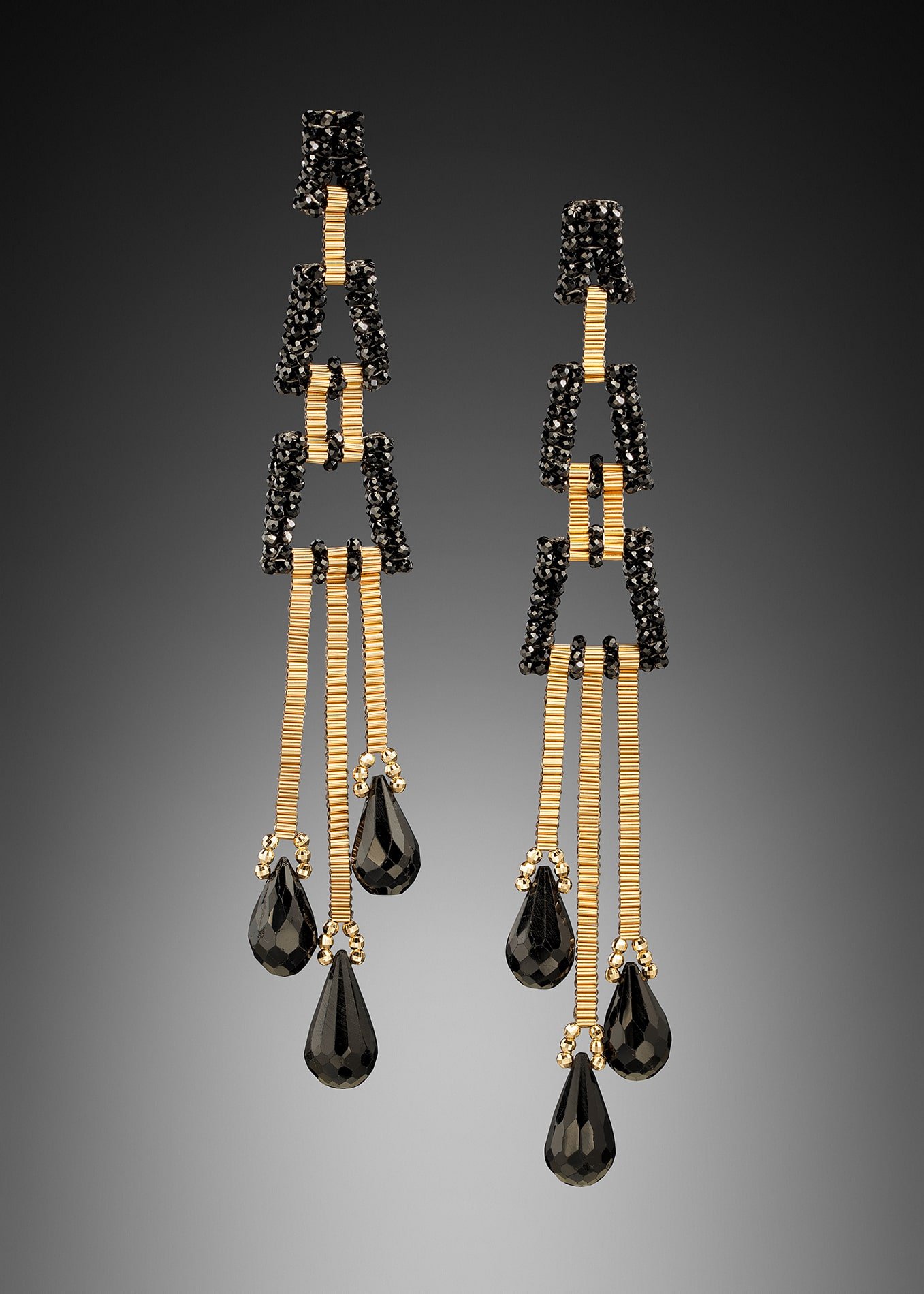 Deco Dusters.  These earrings are hand woven with 14k and black spinel beads.  They are designed to “dust” the shoulders.