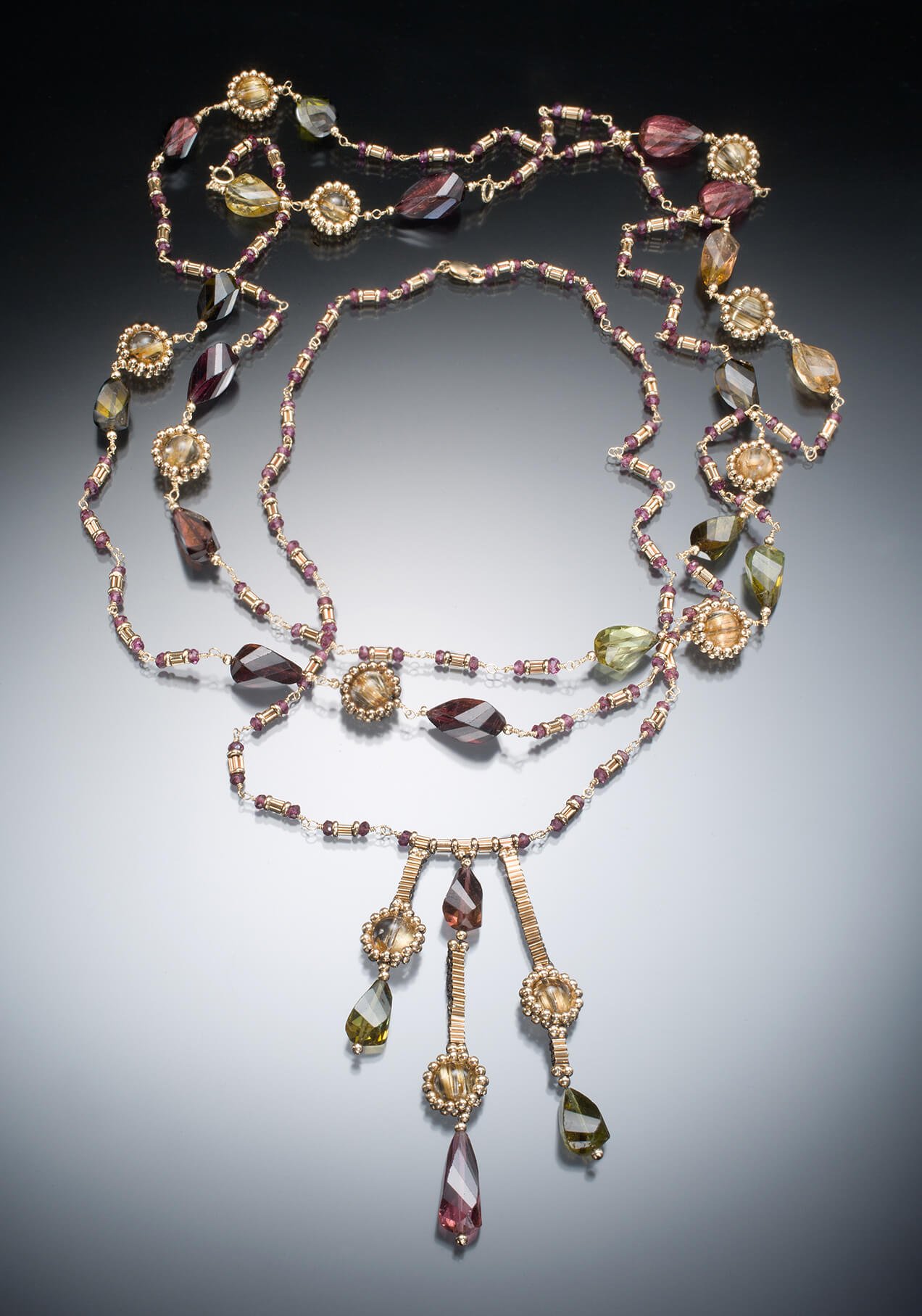 Double Tourmaline Necklaces. These two stacked necklaces are hand woven and wire wrapped of multicolor, fancy-cut, tourmaline beads, and 14k gold.
