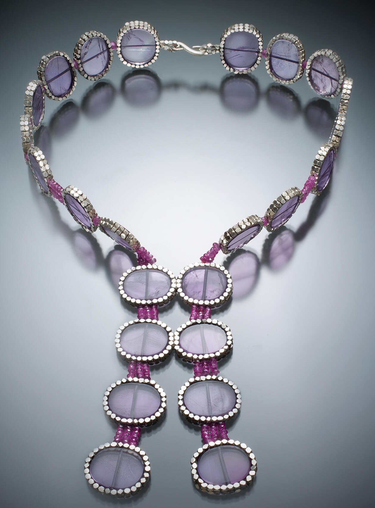 Amethyst Collar. Slices of amethyst are set in hand woven silver and pink sapphire beads.
