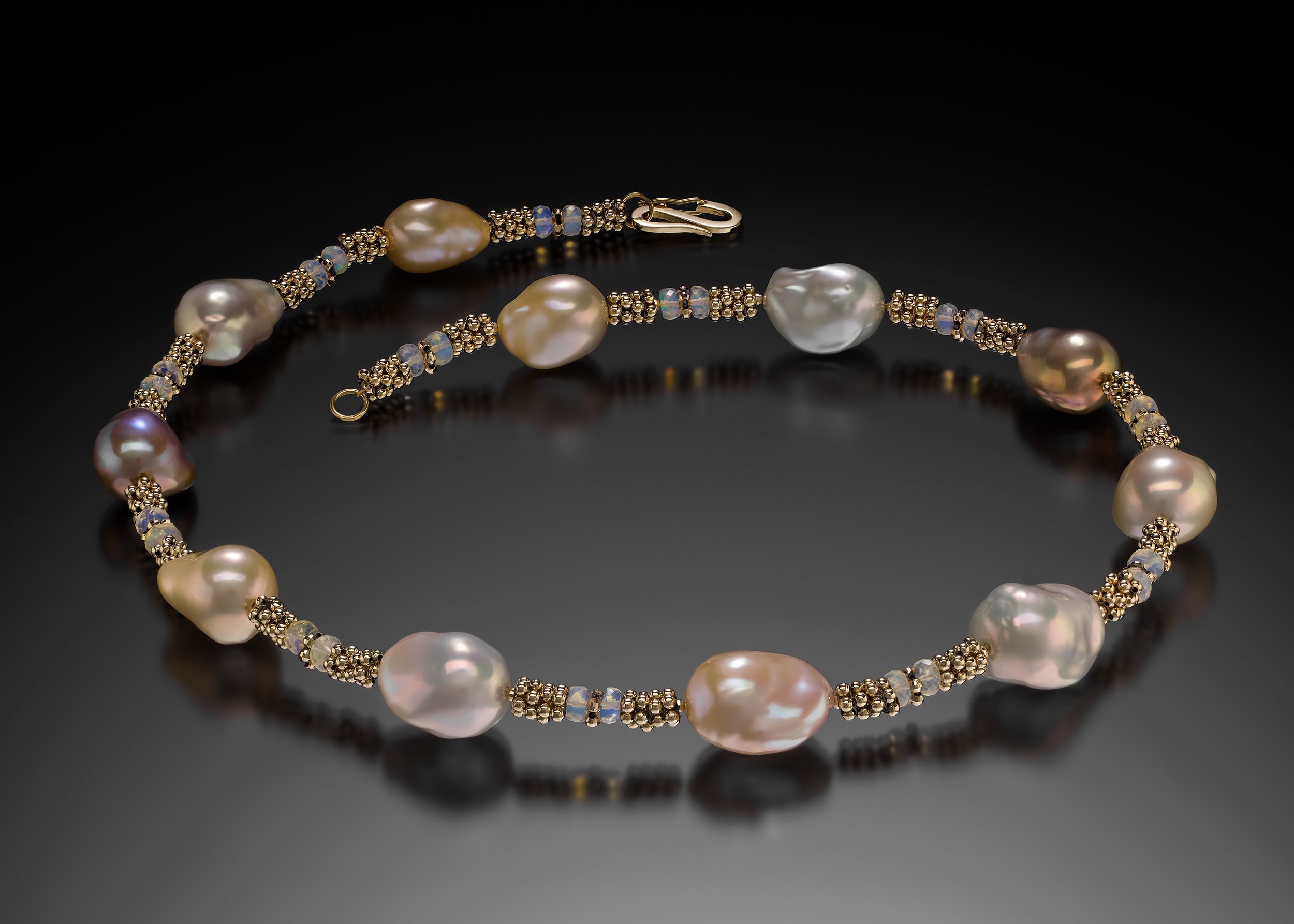 Pearl and Opal Necklace. This necklace is hand woven of 14k gold, and Ethiopian opal beads. Large natural, baroque, pearls are spaced throughout the piece.