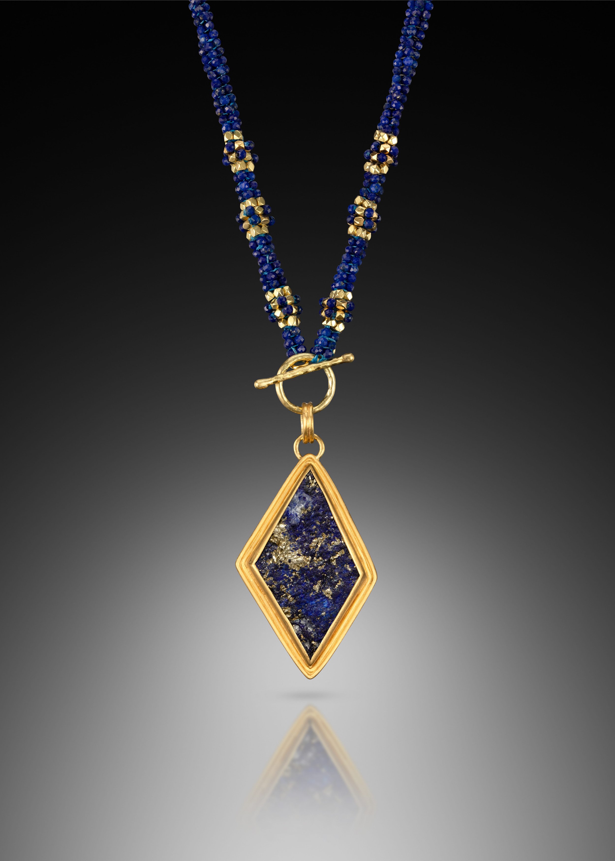 Lapis Pendant Necklace.  Cord, hand-woven of lapis and 20k gold beads.  Pendant, hand-fabricated of 22k gold set with a lapis slice (by Dieter Lorenz).