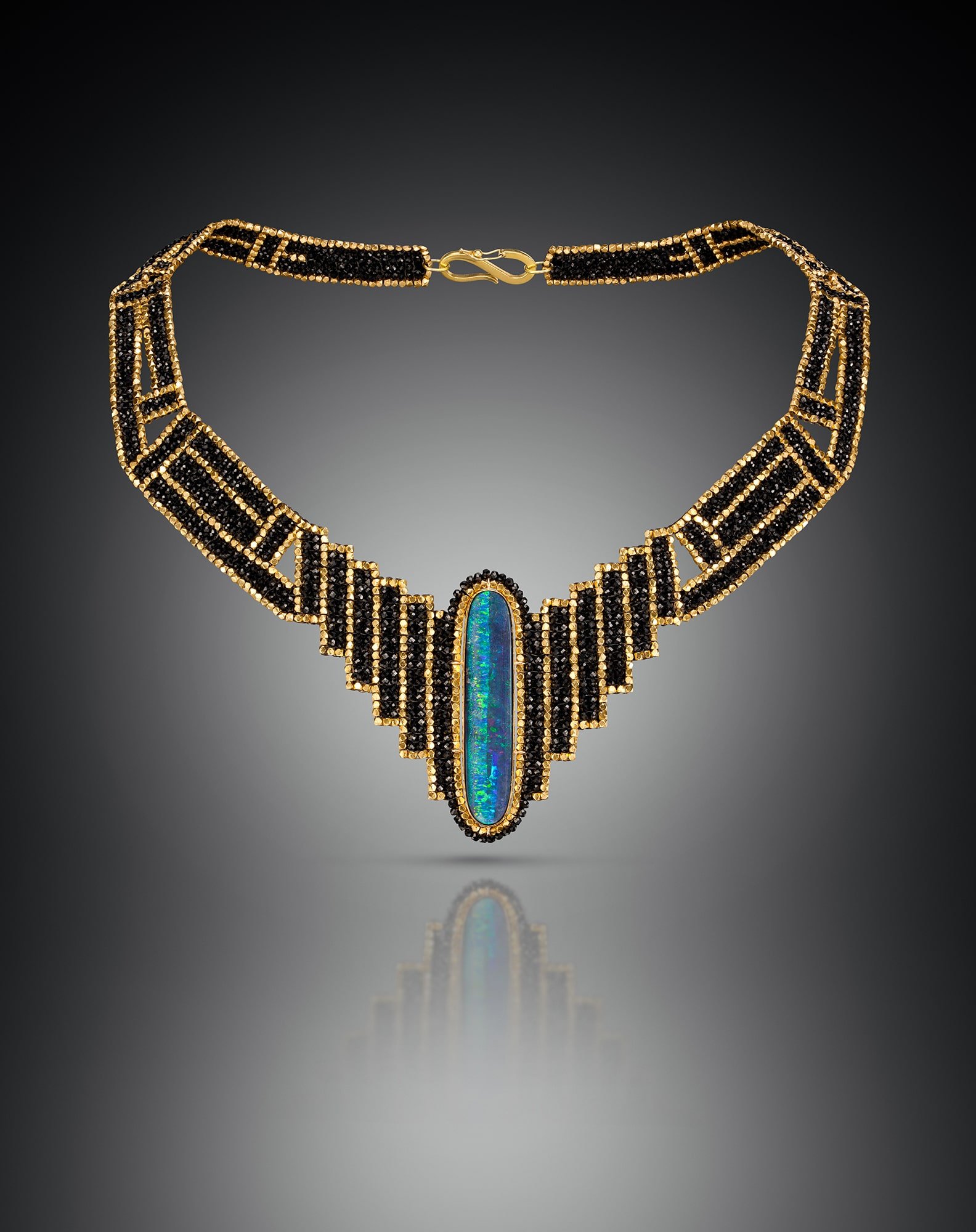 Drama Collar.  Woven of black spinel, and 18k gold beads, this collar has large center opal set in a hand fabricated bezel of 18k gold.