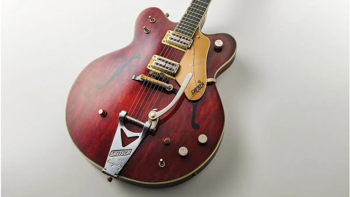 Vintage Gretsch electric guitar with sunburst finish and Bigsby tremolo.