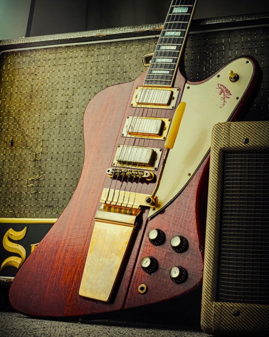 Electric guitar leaning against an amplifier
