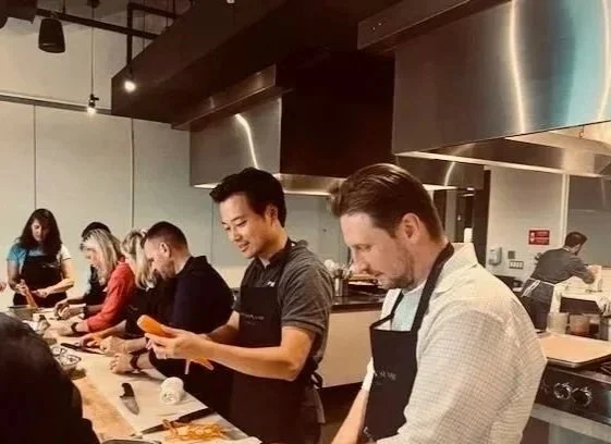 Kevin Hsu with group of employees doing team-building event
