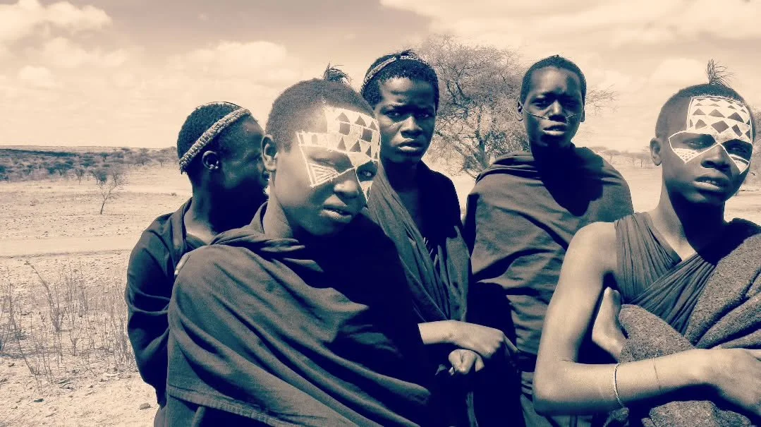 INITIATION 2015 

I met these boys in 2015 while cycling toward the Ngorongoro Crater in Tanzania. They were Maasai initiates, in the period just after circumcision known as morani. They wear black robes and the bold white geometric face paint that m