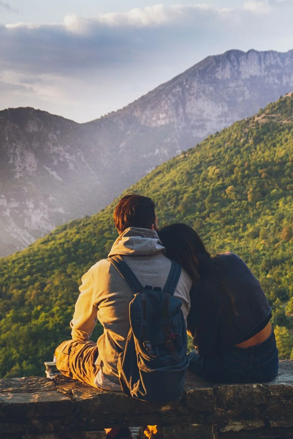 couple at the top of a mountain hike