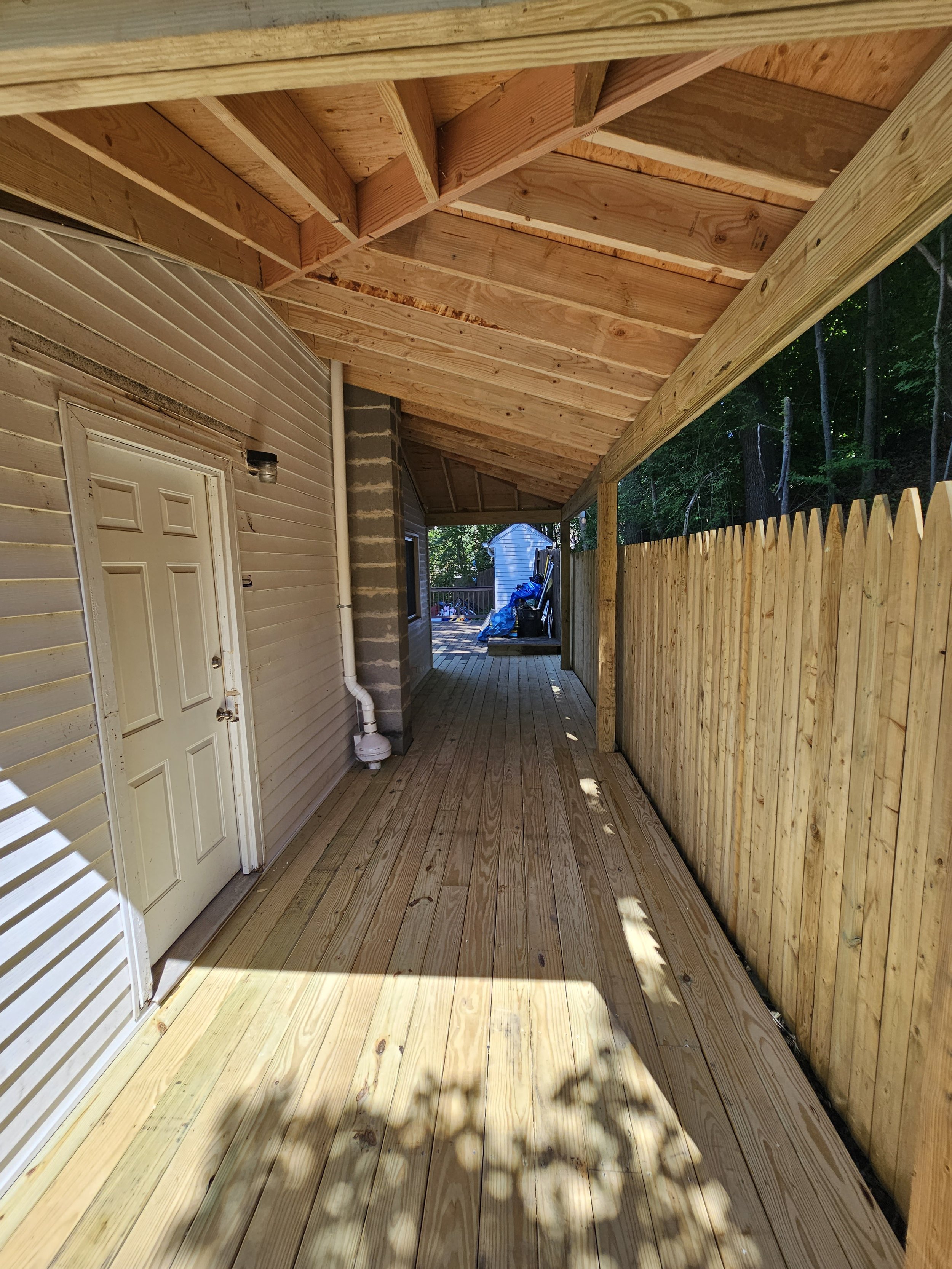 Rebuilt a rotted deck and put a roof on it so it wouldn't happen again, new fence too! west side Worcester