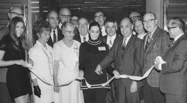 Black-and-white photograph of the 1970 ribbon-cutting ceremony with Postmaster Lim P. Lee, acting chairman Joseph Clary, and other WESTPEX volunteers