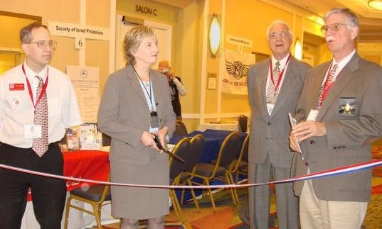 The 2009 WESTPEX ribbon-cutting with San Mateo Postmaster Carol Conroy, APS Deputy Executive Director Kenneth P. Martin, Vice-Chairman George Shalimoff, and Chairman Edward Jarvis