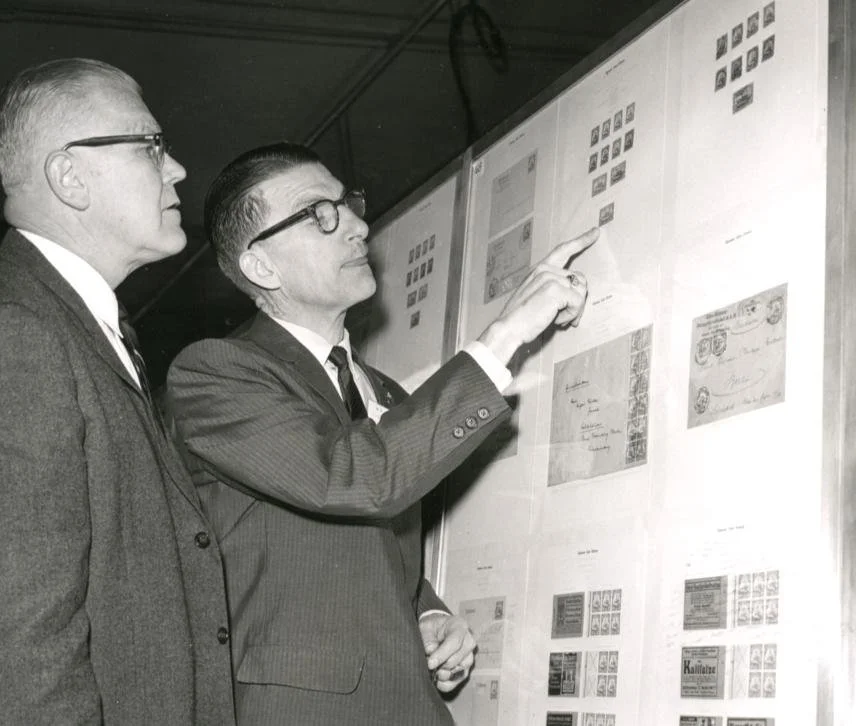 Joseph Clary and Cyrus Thompson examining exhibits at an early WESTPEX show