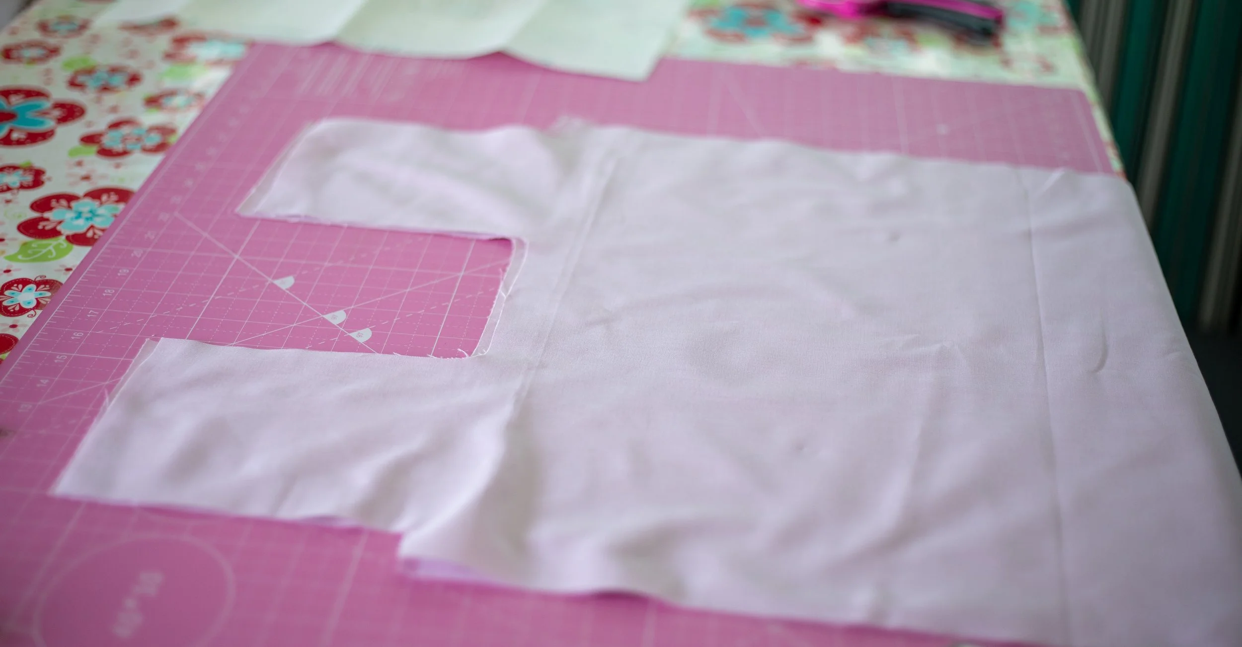 Sewing a reusable bag, purple fabric cut out.