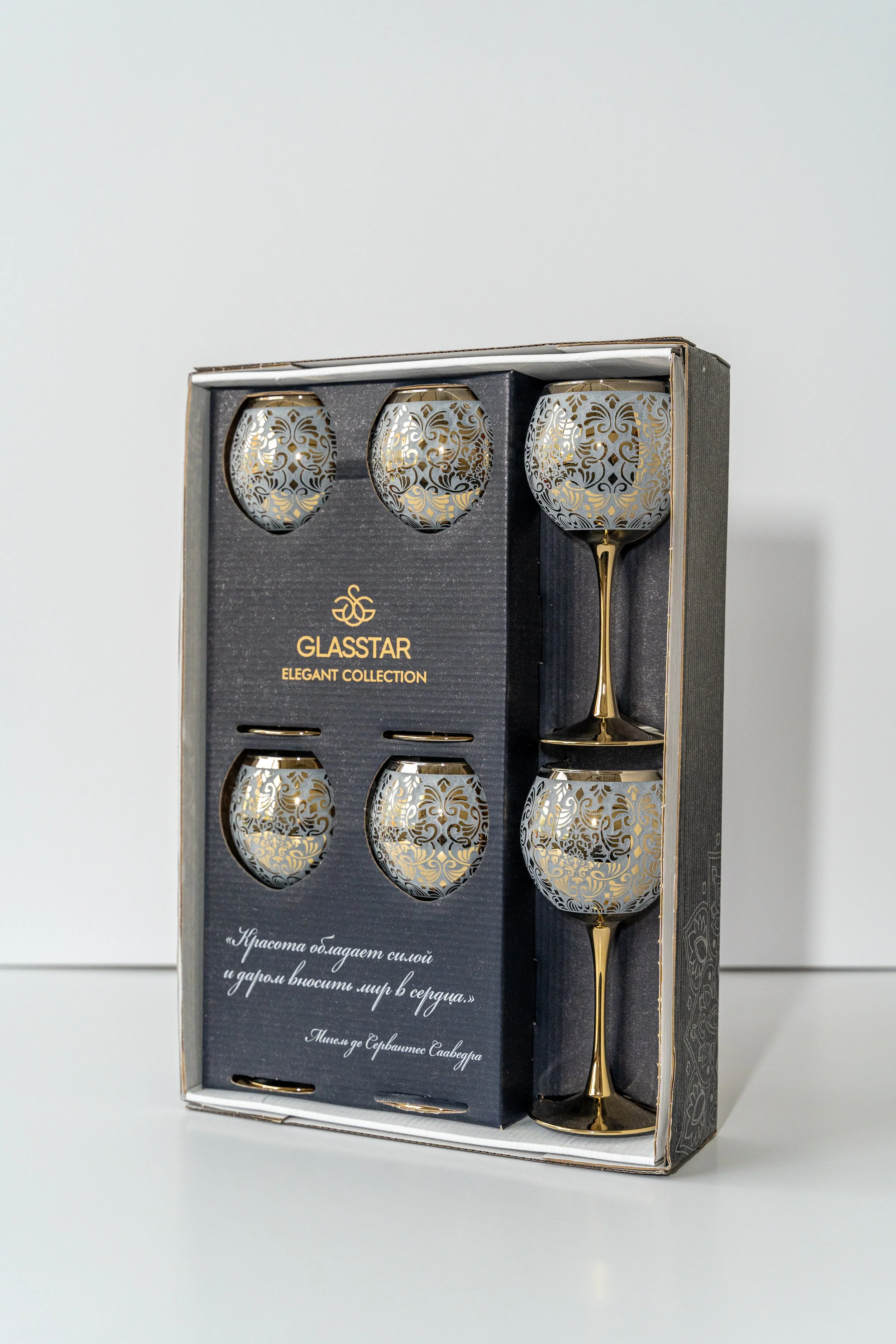 Set of six elegant glassware with gold floral patterns, in black packaging with gold writing, labeled "GLASSTAR ELEGANT COLLECTION."