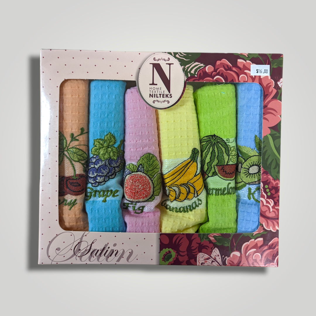 Set of five colorful embroidered dish towels with fruit designs and labels, in decorative packaging.