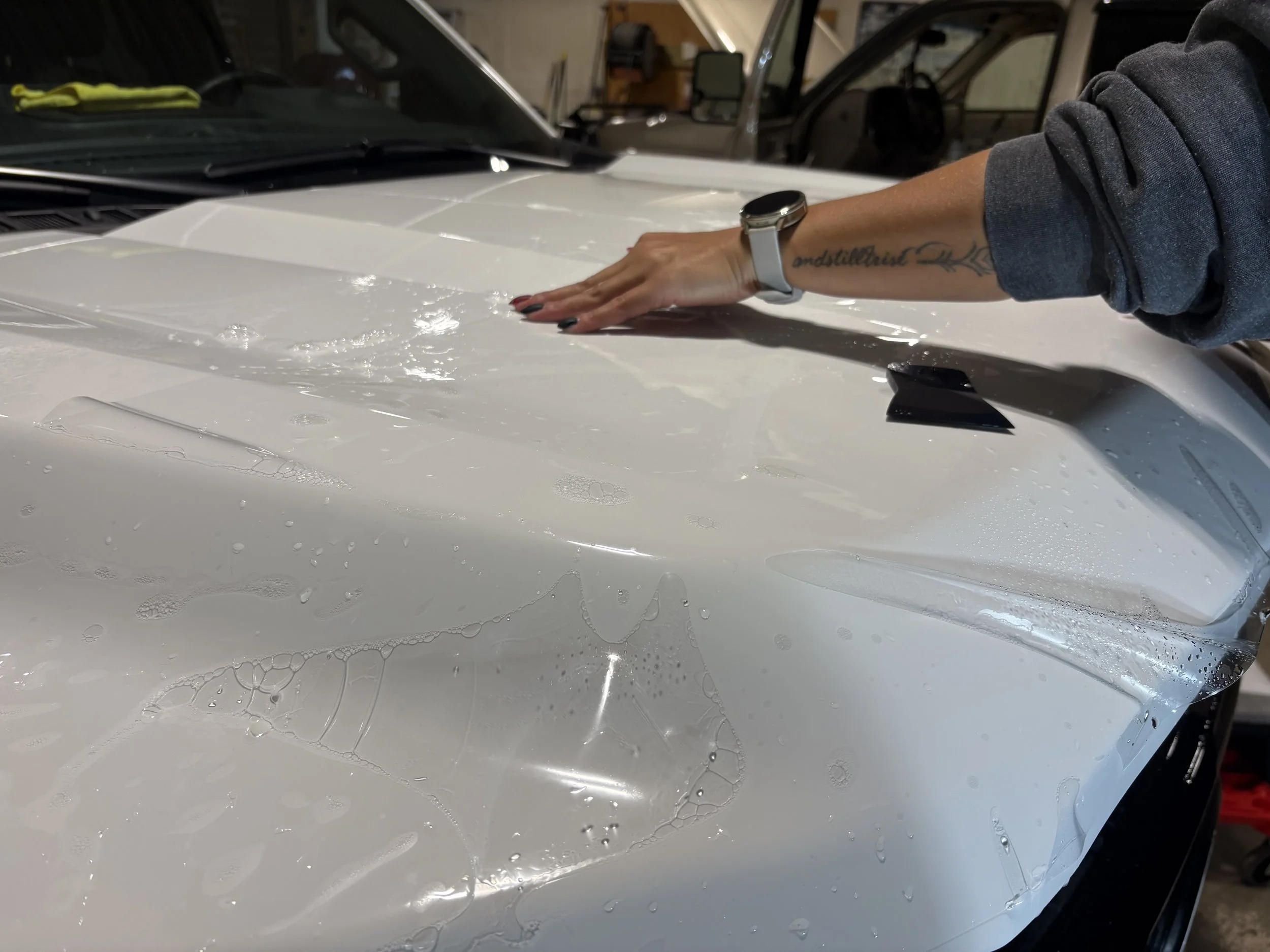 Professional PPF installation on a vehicle hood at Pick 6 in Ponoka