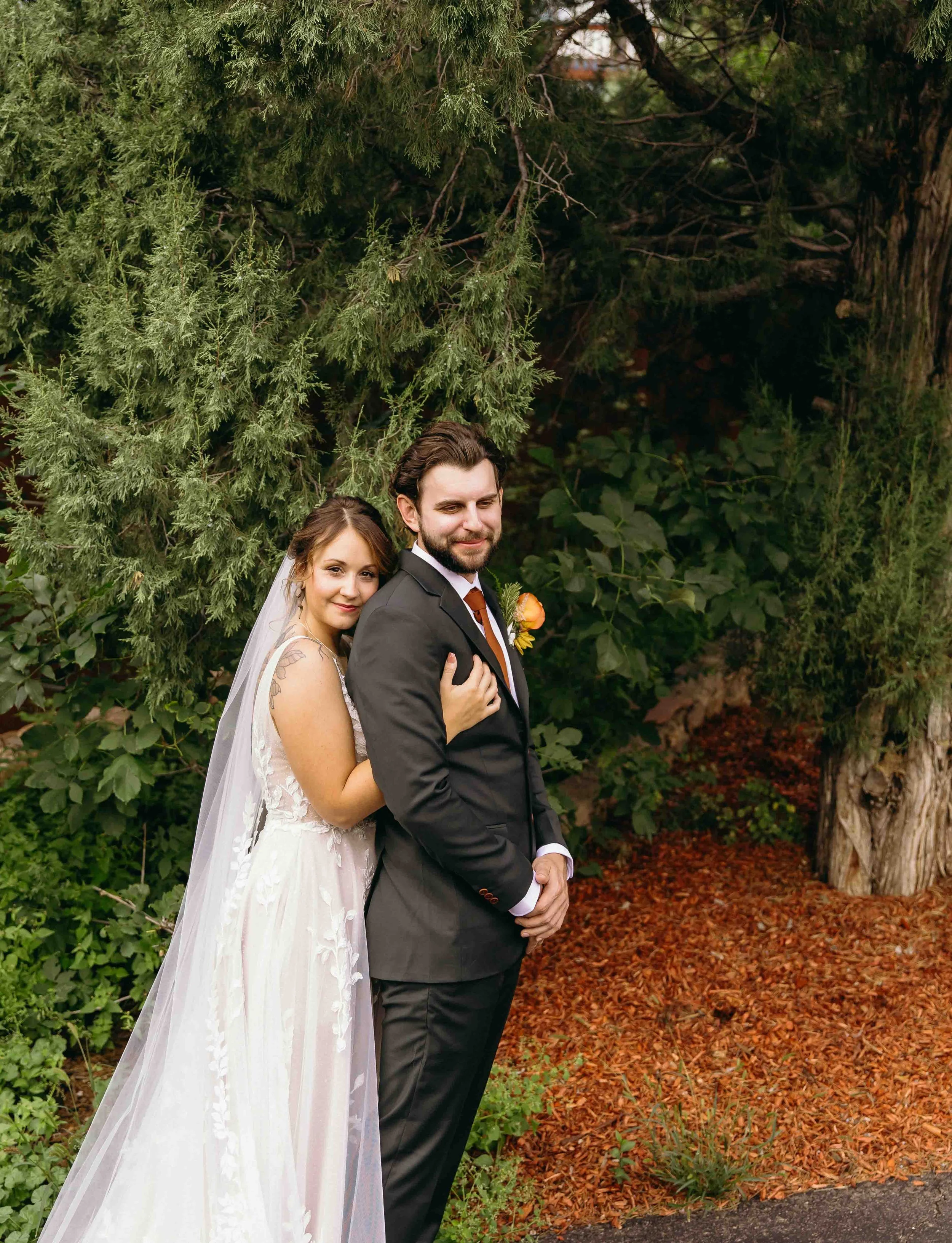 Intimate summer wedding at Craftwood Peak by Wedgewood weddings with colorful autumnal flowers florals, genuine joy and laughter, fun reception with unique vendors. A couple embraces after their first look