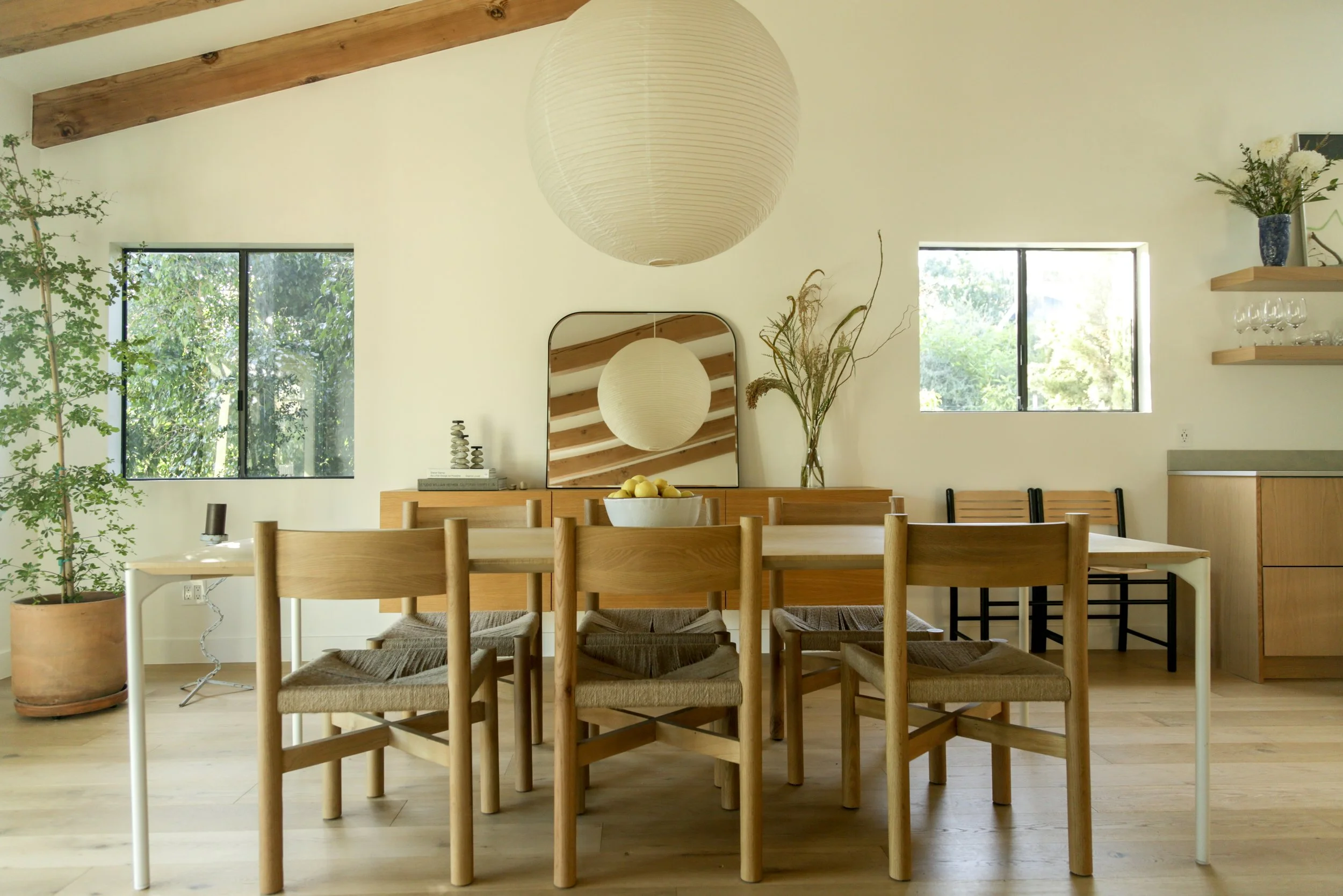 Warm wood dining room in a Northeast Los Angeles Airbnb designed for guests