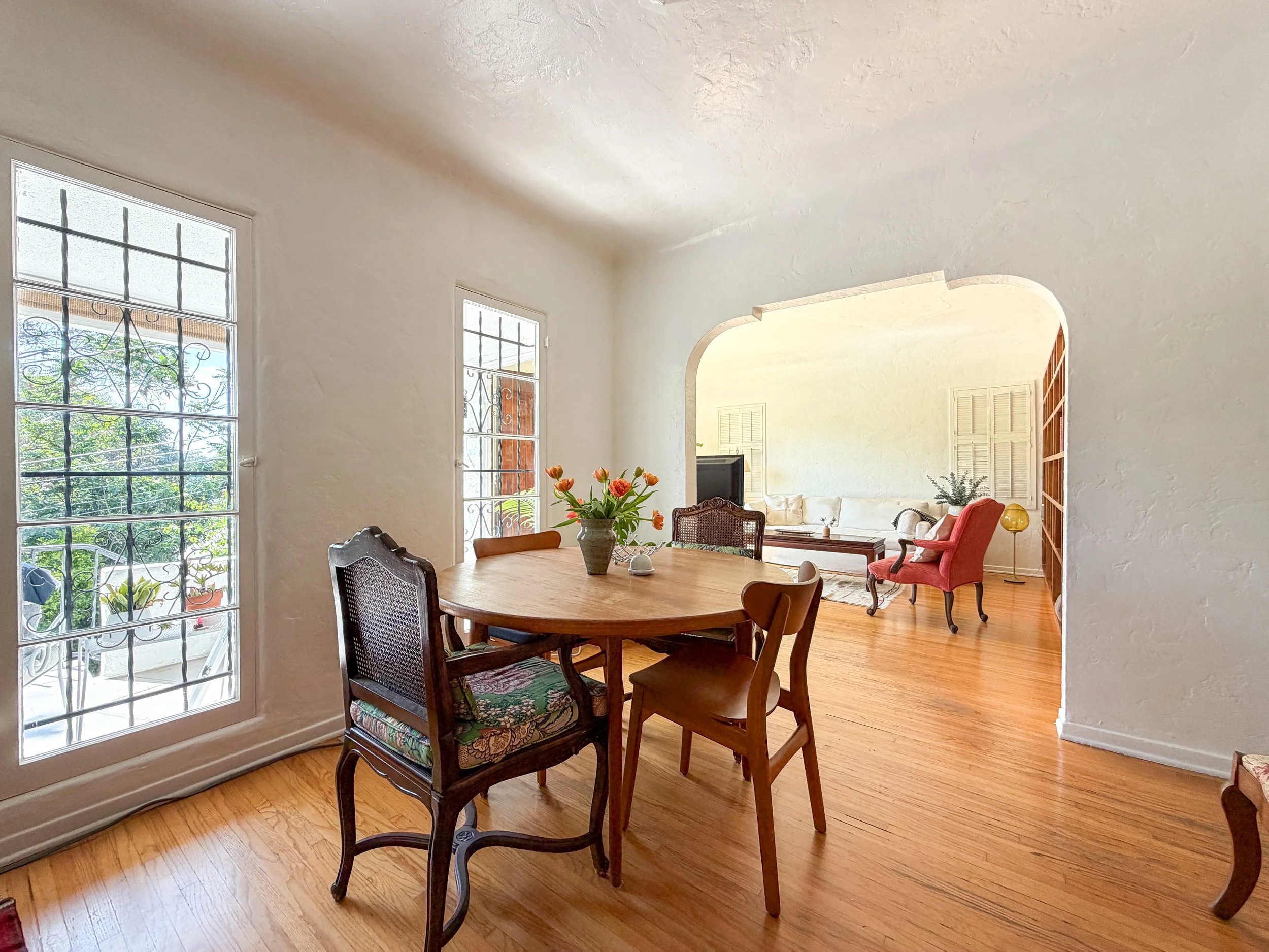 Vintage-inspired dining and living room in a Highland Park Airbnb designed by Homing Interiors