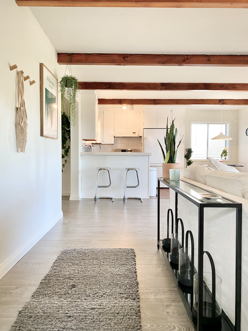 Open kitchen and living space in a Los Feliz Airbnb with warm wood details