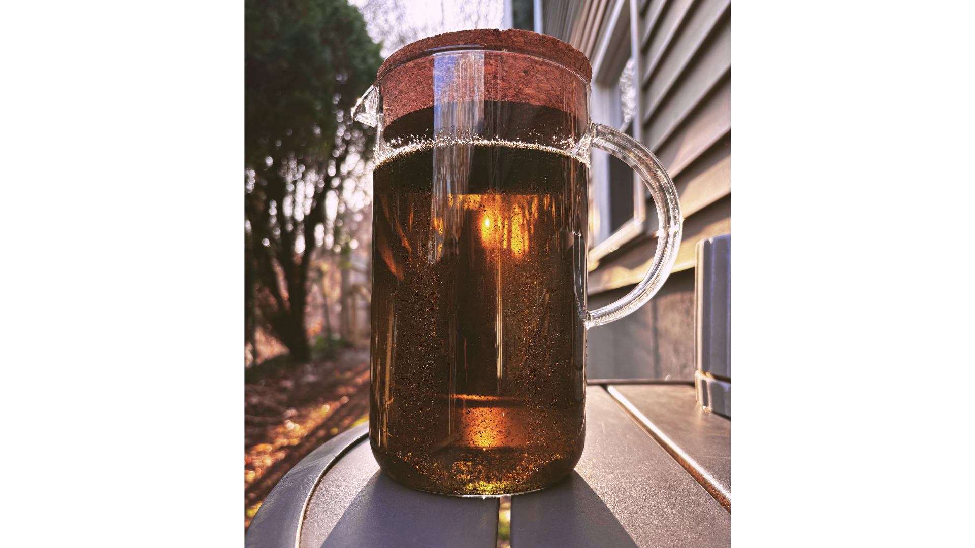 An infusion of nettle leaf in a carafe with a cork top.