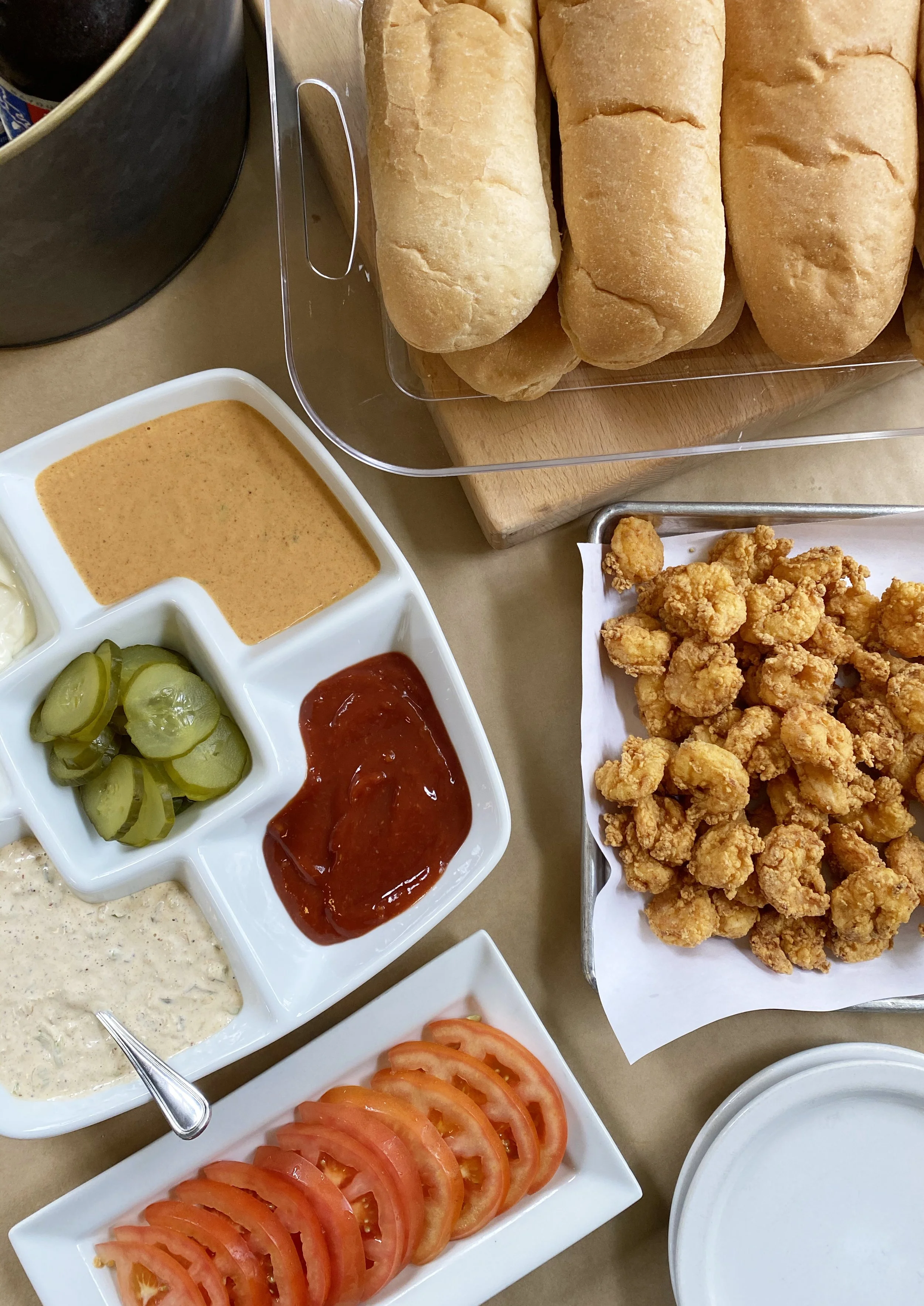Buffet trays with assorted poboys for LSU tailgates