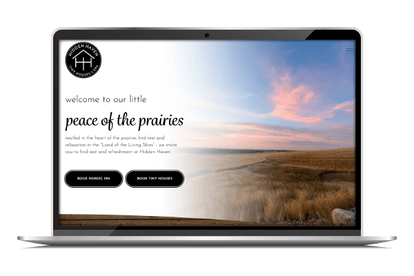 A laptop displaying the Hidden Haven Tiny Houses & Nordic Spa homepage.