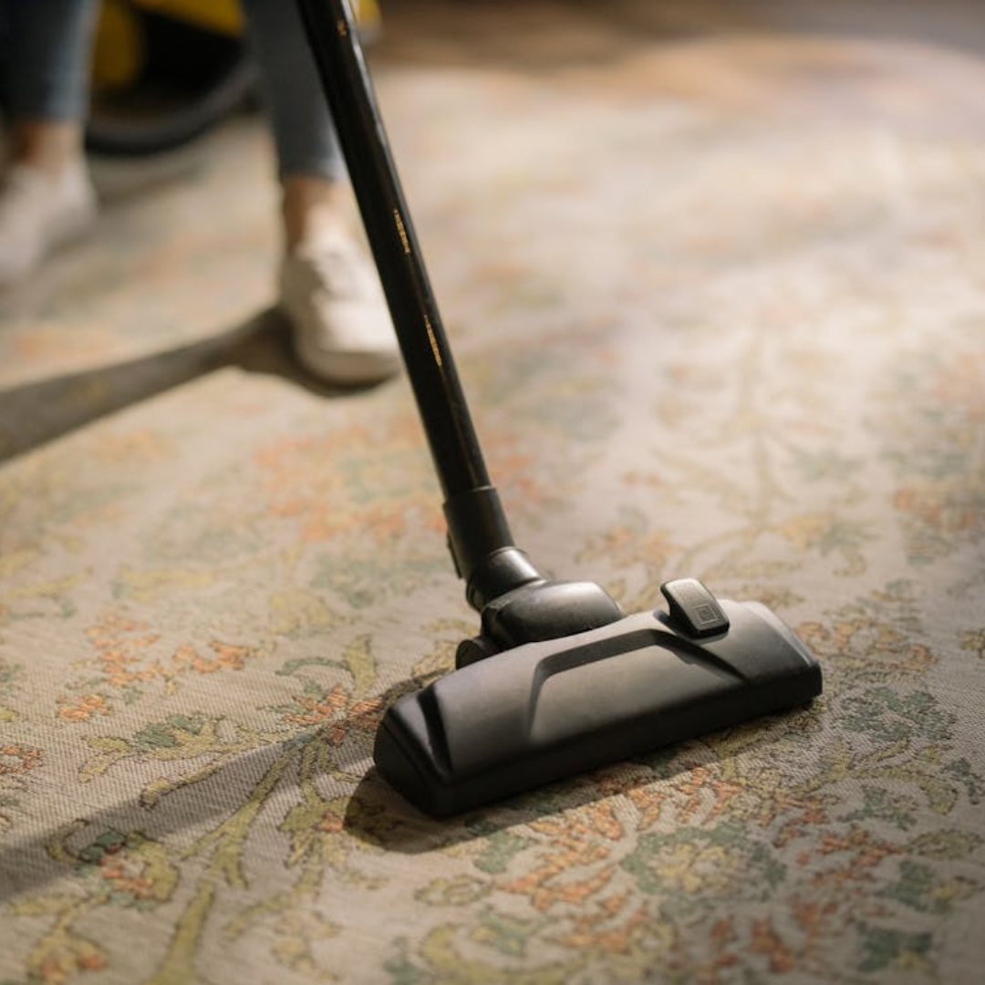 Lightweight ducted vacuum hose being used to clean floors in a quiet Perth home