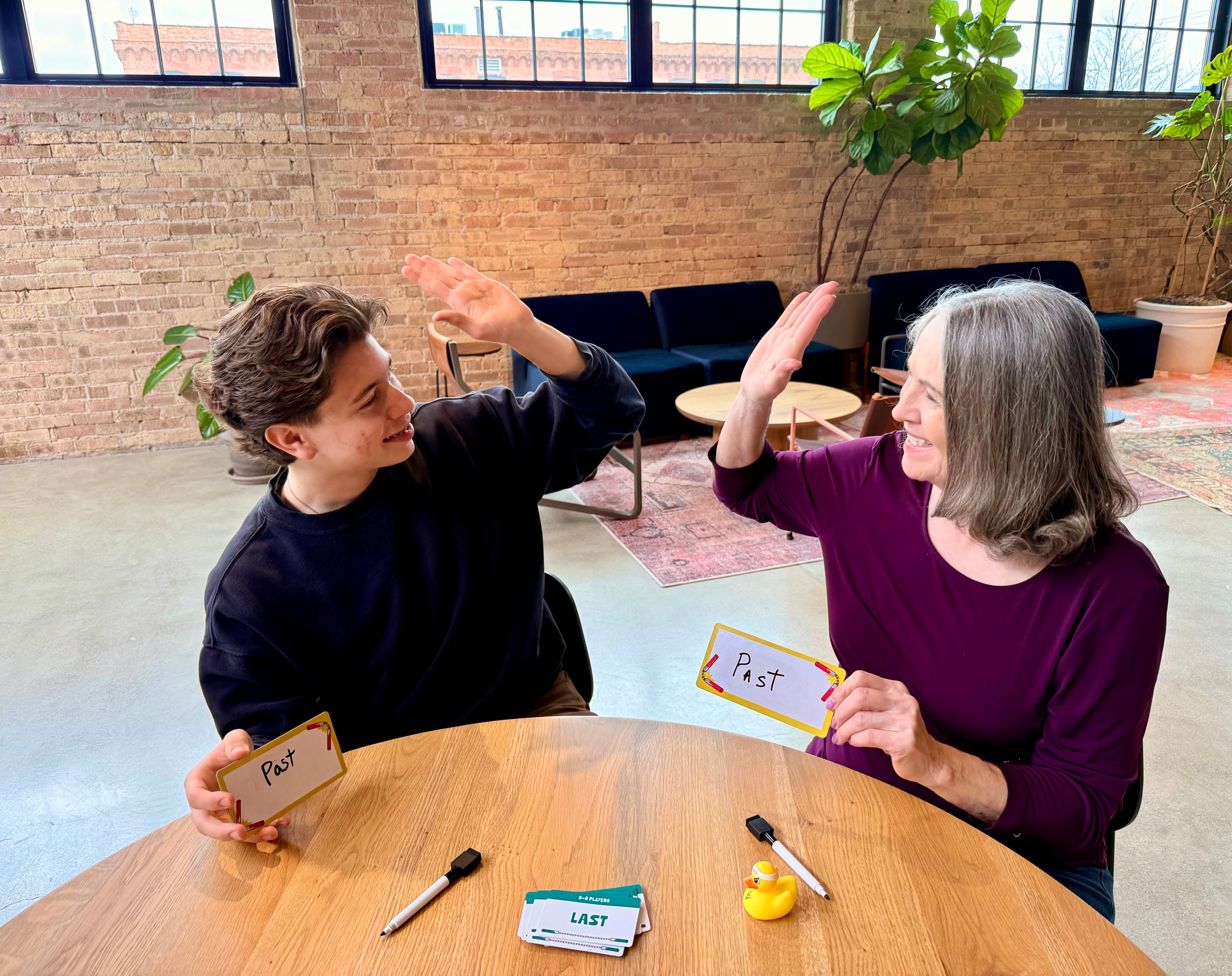 grandma and grandson going in for high five.png