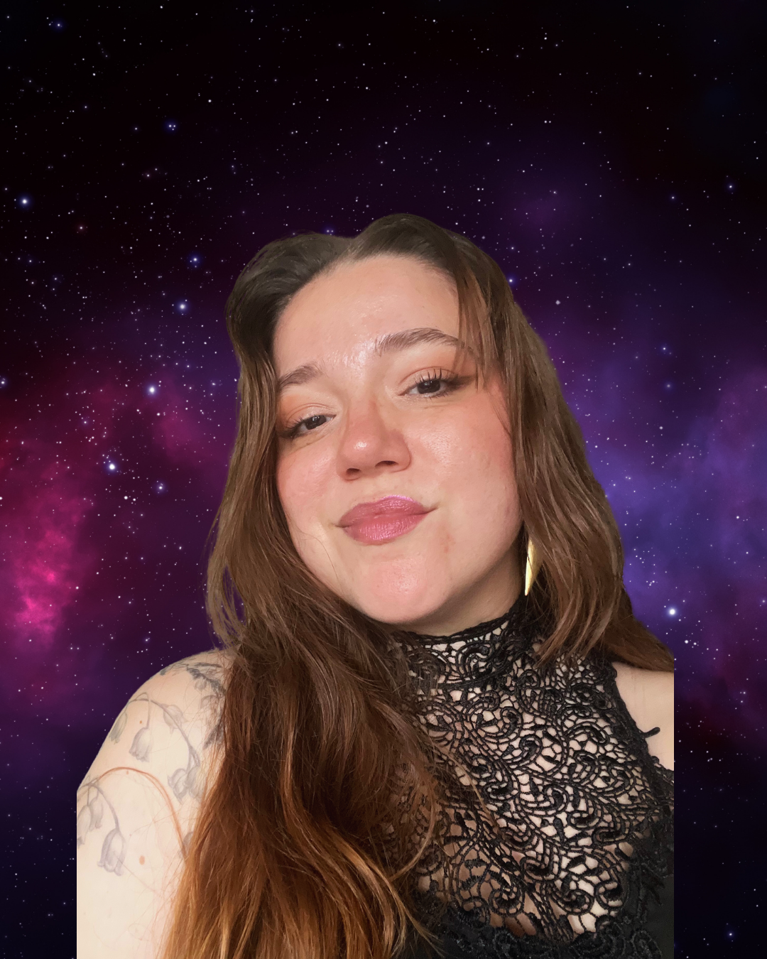 A young woman with long brown hair, wearing a black lace top, posing in front of a starry space background.