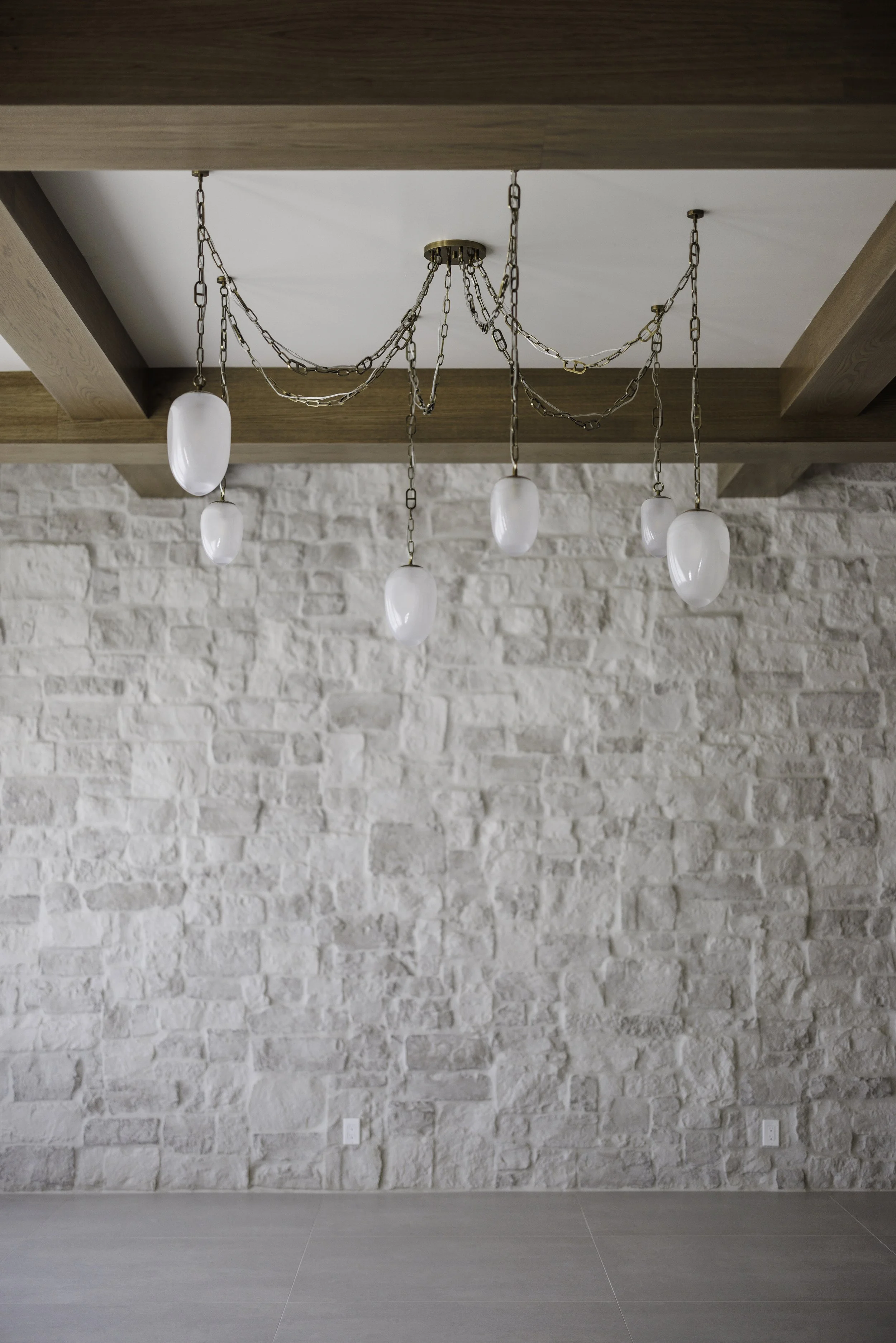aunty_J_Interiors_Destin_FL_Den_Custom_Stone_Wall.jpg