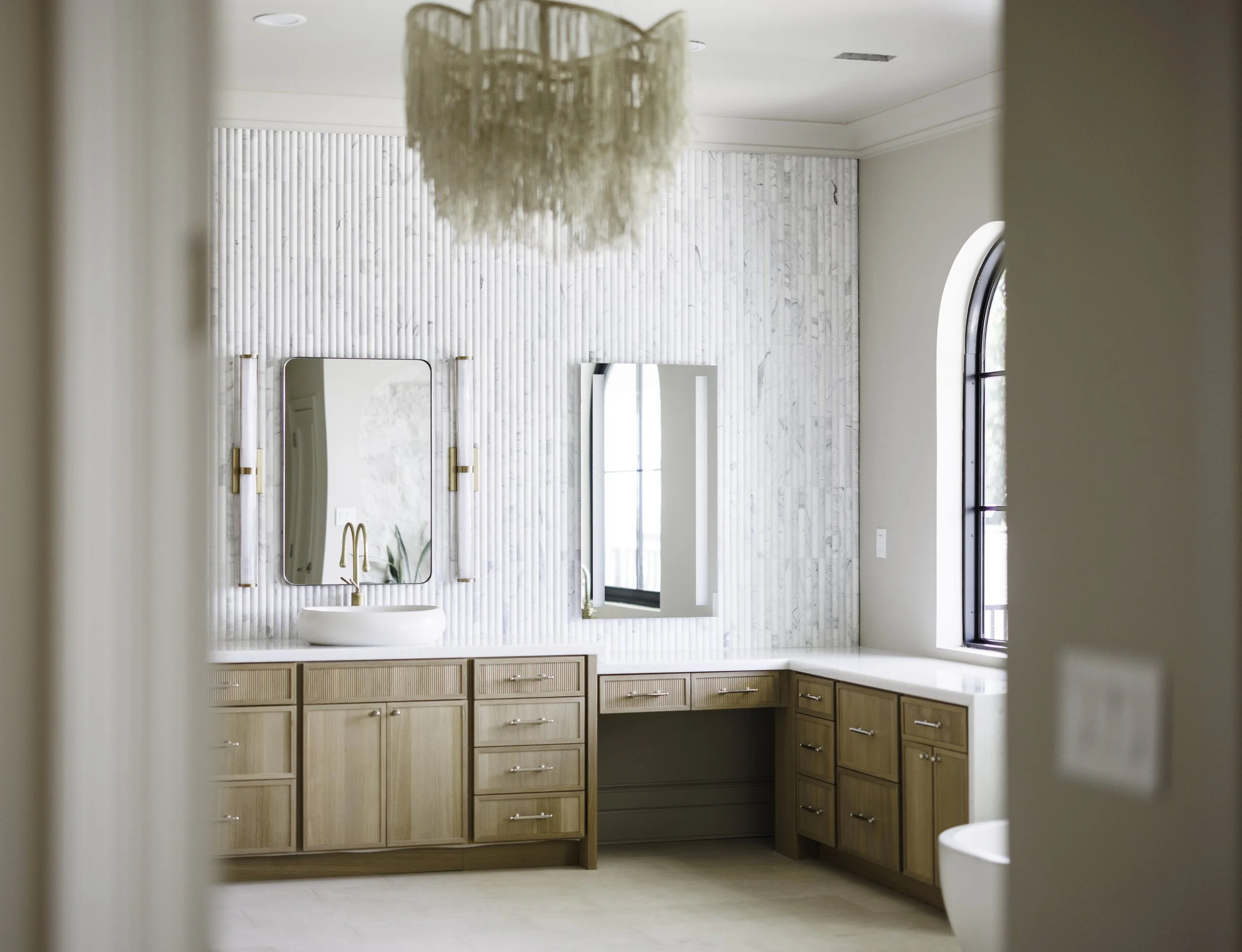 aunty_J_Interiors_Destin_FL_Primary_Bathroom_Fluted_Tile.jpg