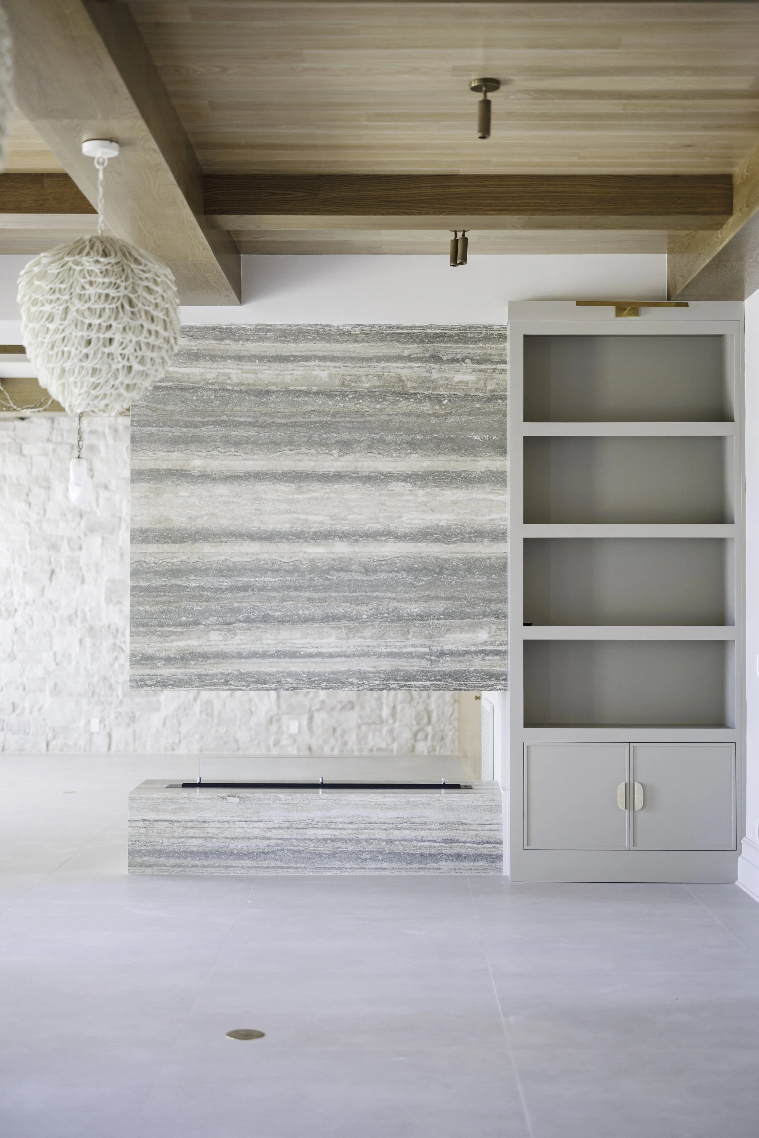 aunty_J_Interiors_Destin_FL_Stone_Modern_Fireplace.jpg