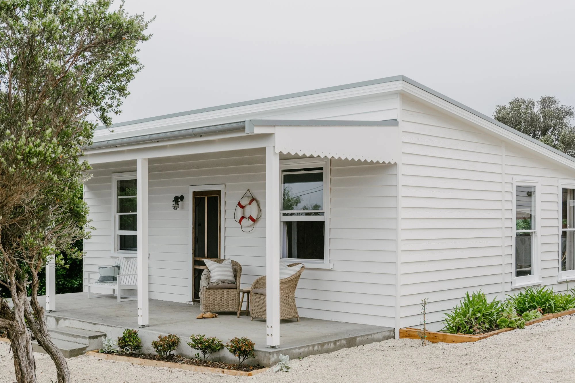 Port Cottage, is an iconic white weatherboard cottage by the sea in Port Campbell. 