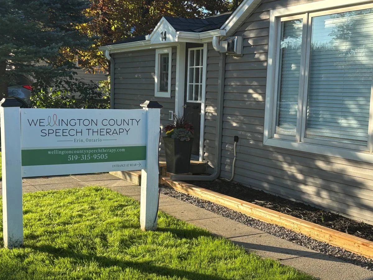 Front of clinic building with sign