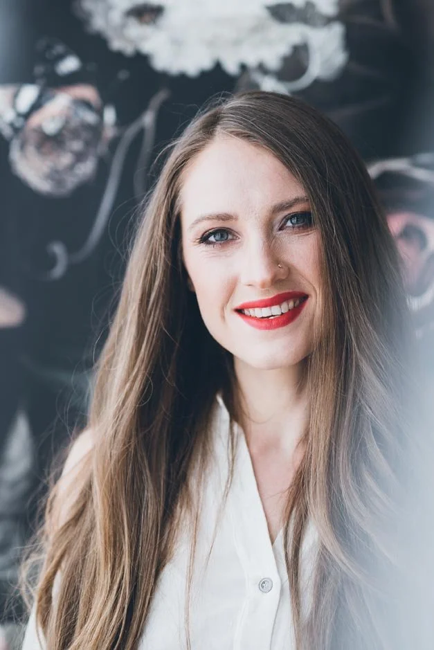 woman with long hair smiling