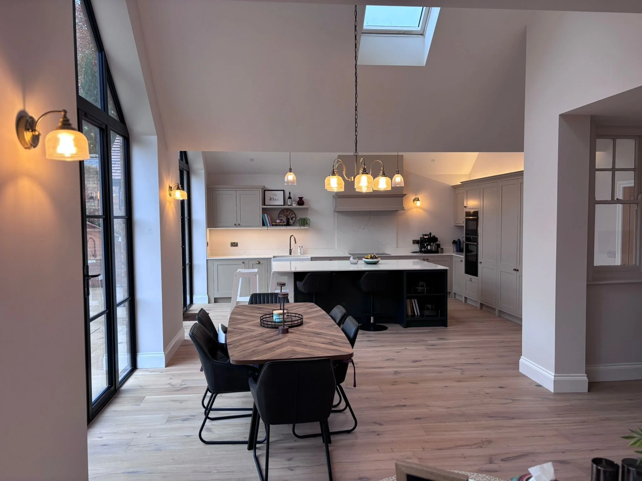 Handmade inframe shaker kitchen with island and oak flooring inside a modern family extension in Woodthorpe Nottingham