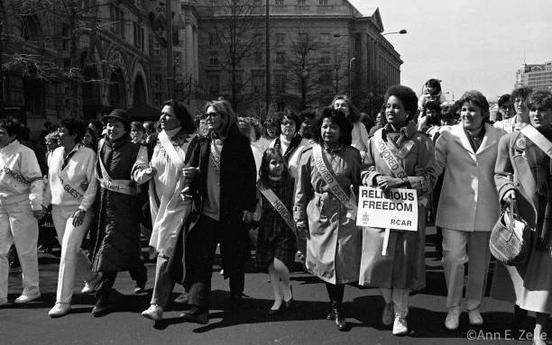 March 09, 1986
View along the front line of Honored Guests as they lead the Pro Choice March for Women's Lives on Pennsylvania Avenue NW (at approximately 11th St NW), Washington DC, March 9, 1986. Among those pictured are, from fifth left, American 