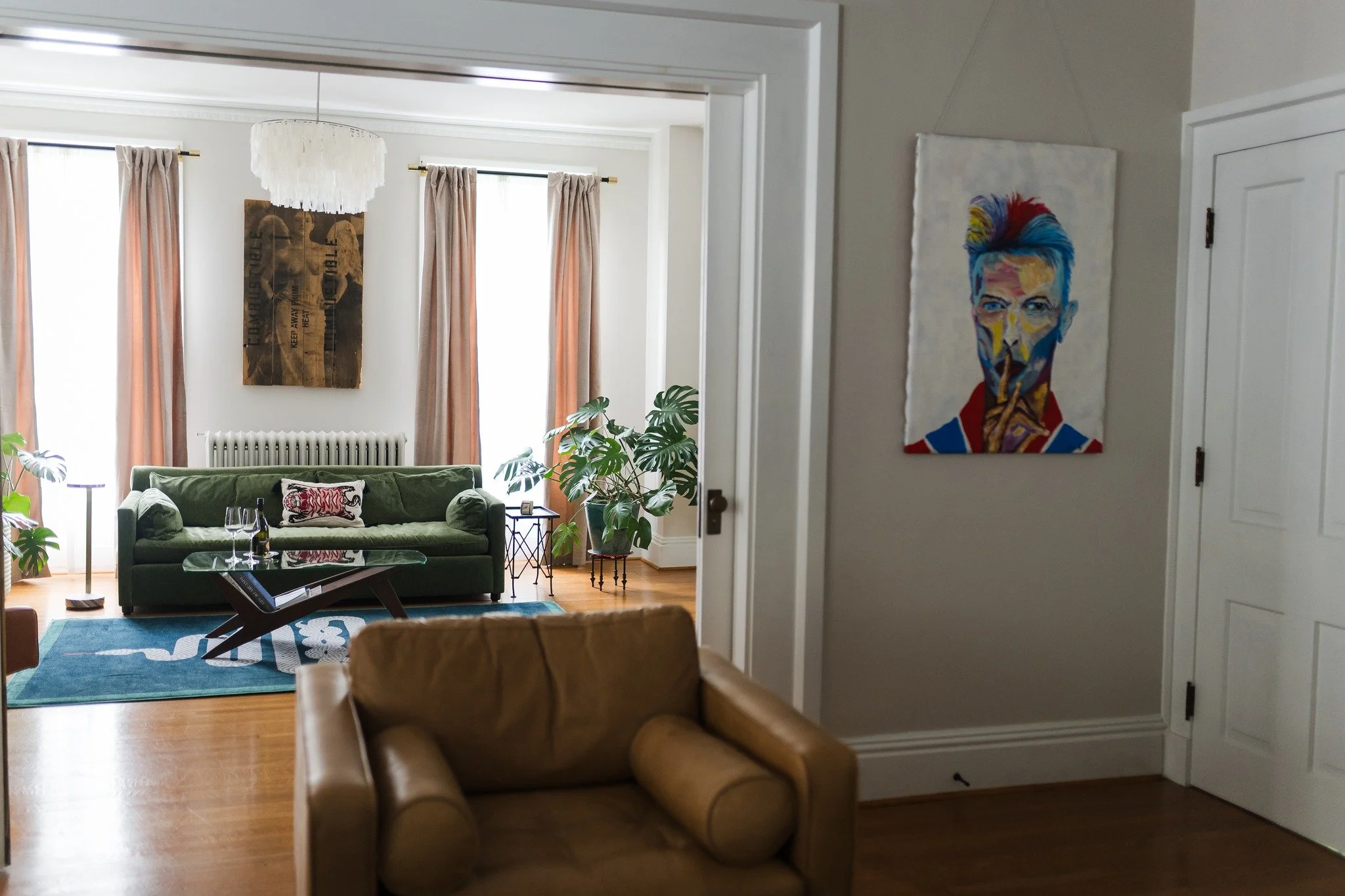 One of the things that makes the Guesthouse special is our collection of art. You won't find any reproductions on our walls. All original, collected overtime, curated for your enjoyment. Because what you put on your walls should tell a story&mdash;no