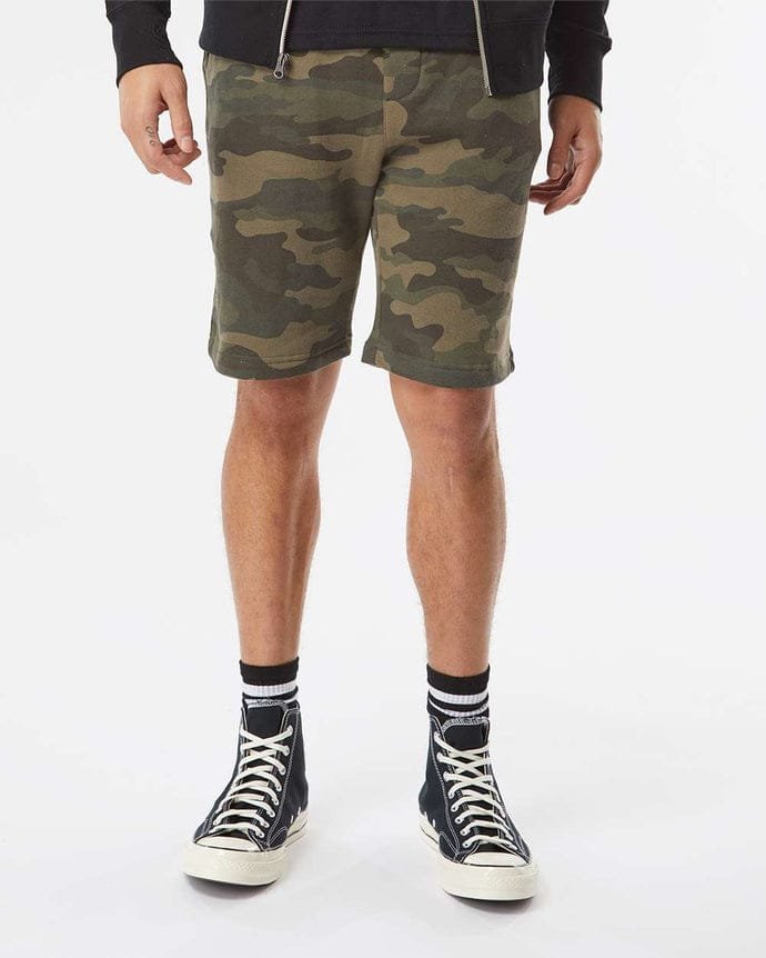 Advertisement for pigmented-dyed fleece shorts in beige, dark gray, pink, and blue, with contact information and product details listed.