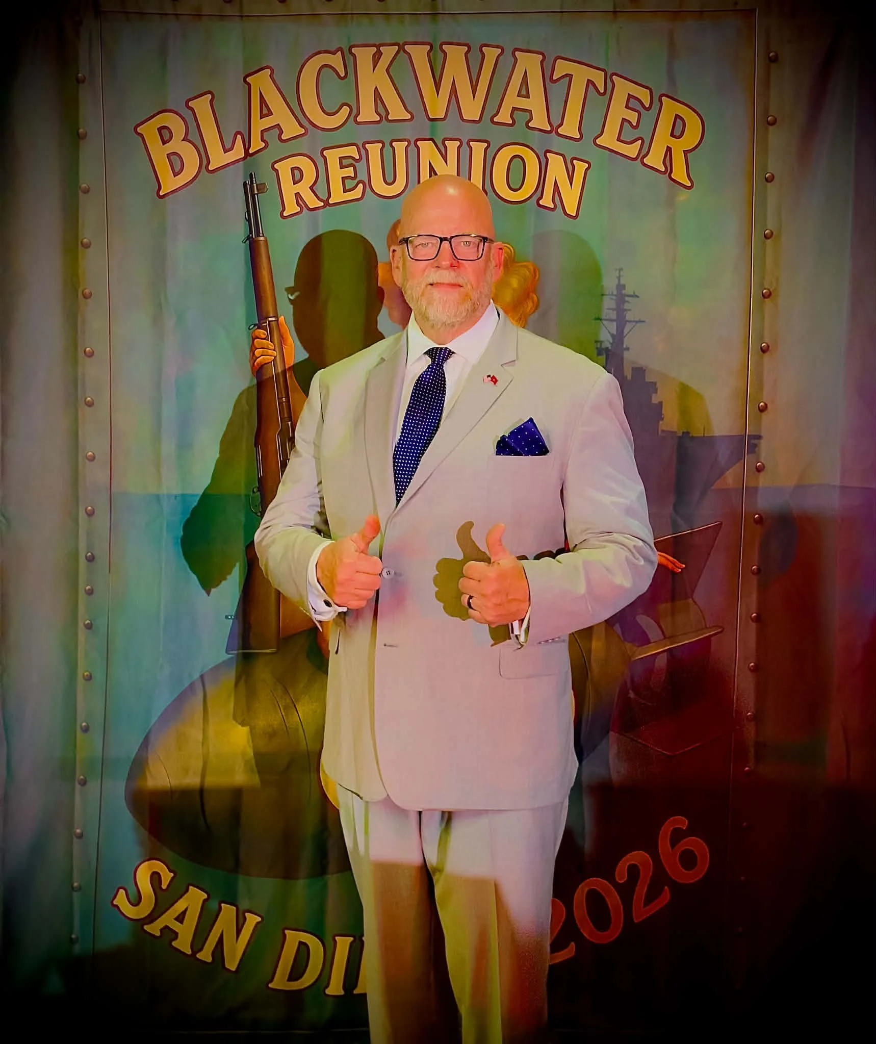 Premier charity auctioneer George Wooden at Blackwater Reunion Gala on USS Midway 2026