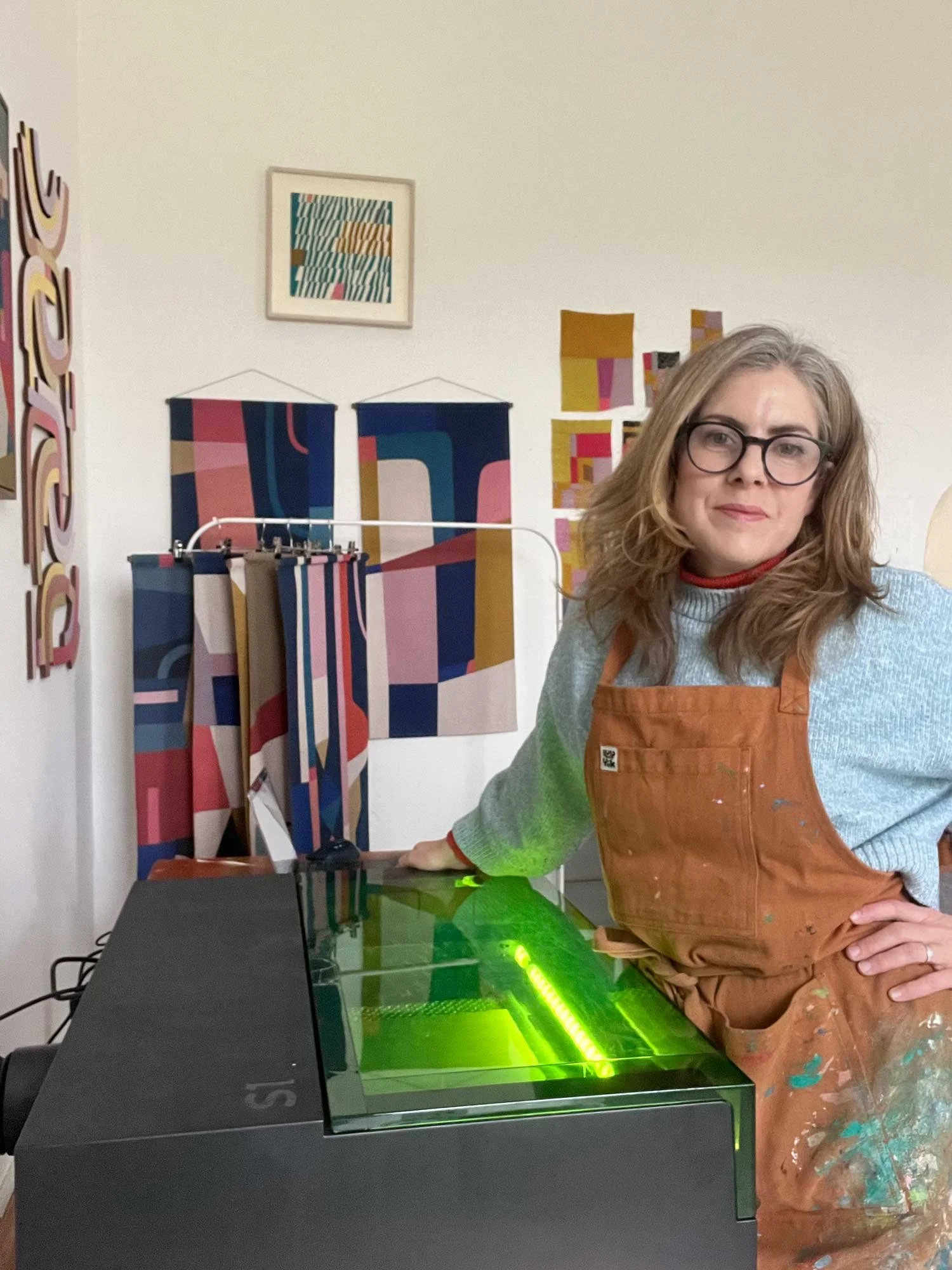 Irish artist and printmaker Maria Atanackovic with her laser cutter at her studio at Ardgillan Castle