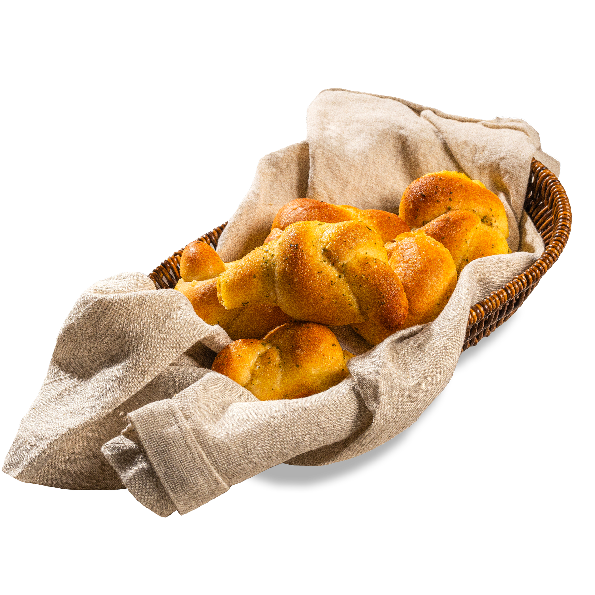 Basket of flaky bread rolls lined with cloth.