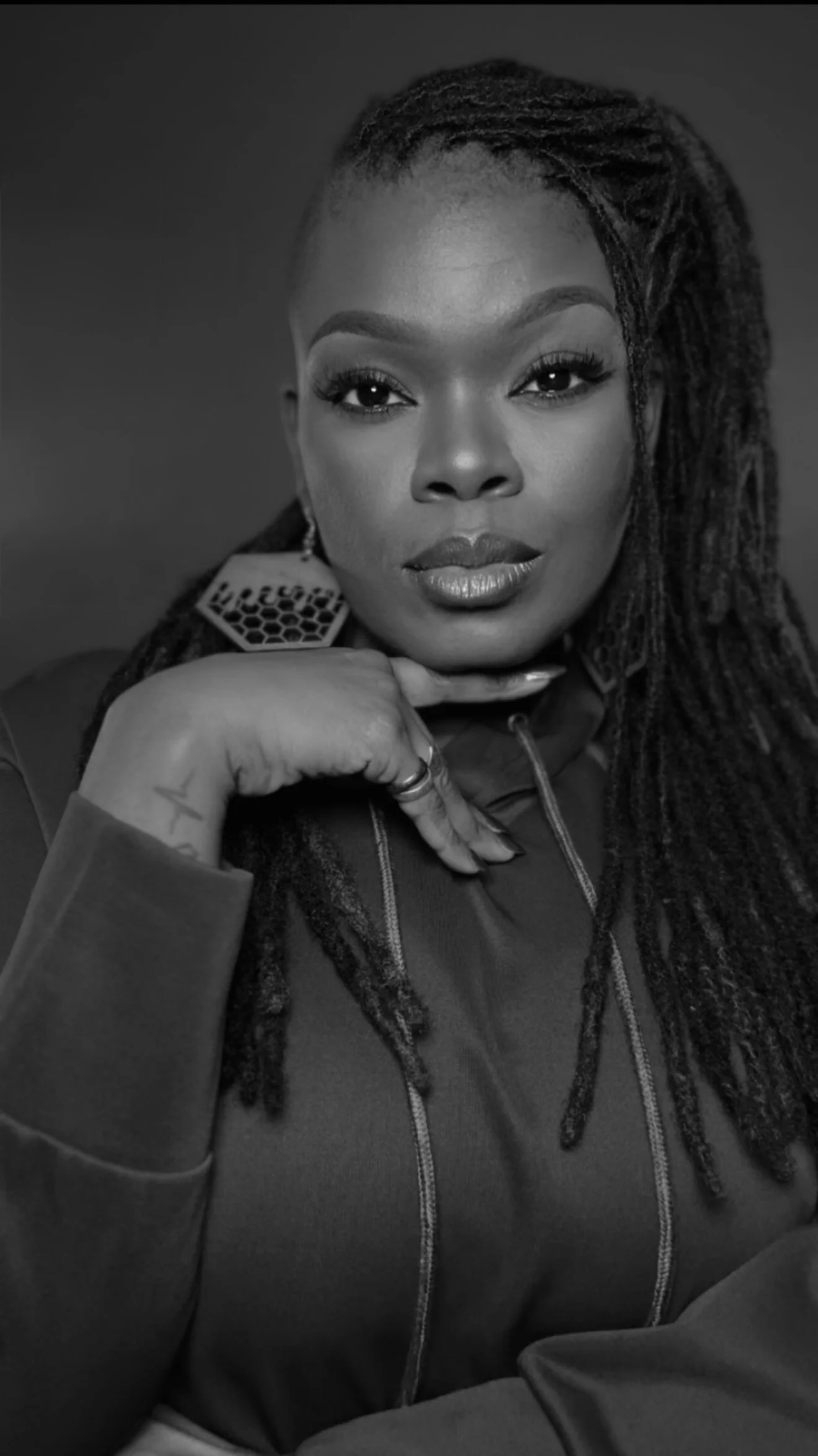 Tiffany Moníque, R&B vocalist and recording artist, black-and-white portrait.
