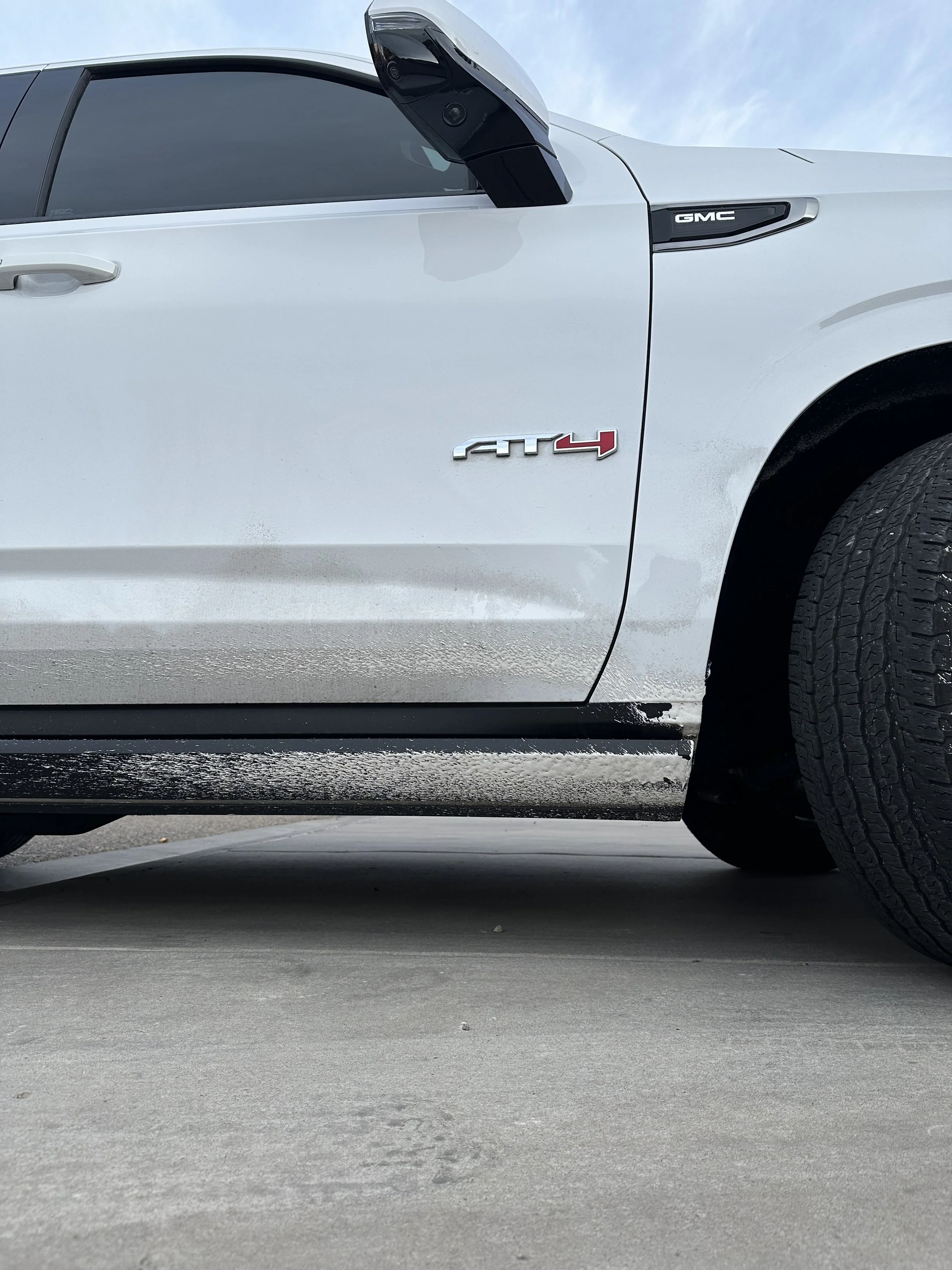 Road overspray on paint removal detail
