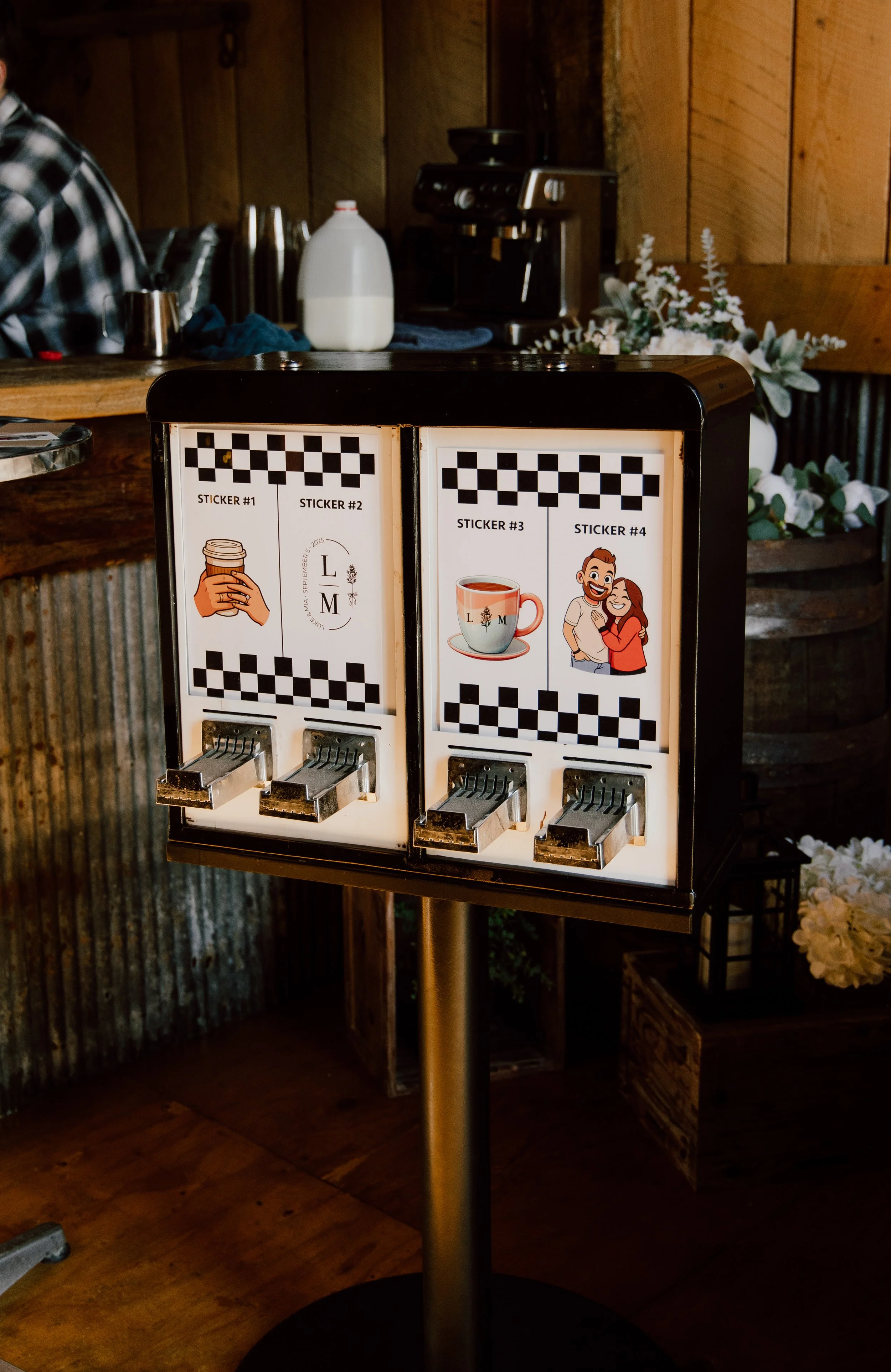 A coffee station with a vending machine for coffee-themed stickers in a rustic setting.