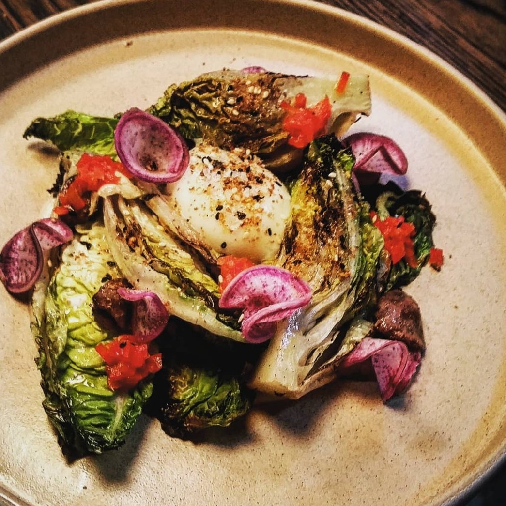 Grilled Little Gem Salad with Chicken Hearts and Soft Poached Egg