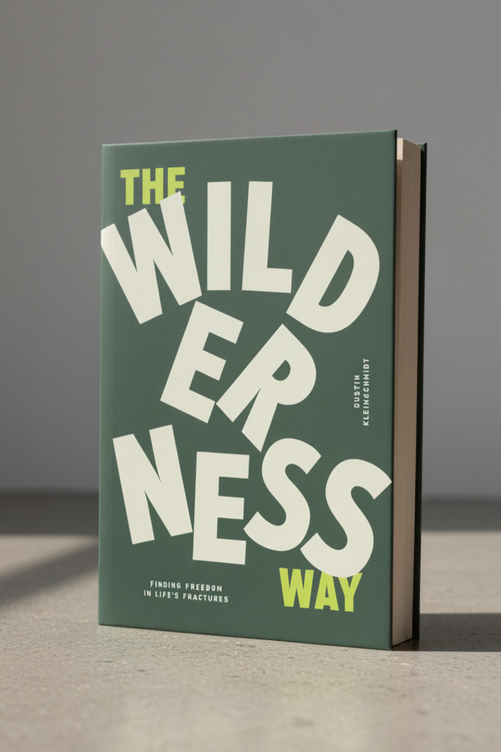 A book titled 'The Wilderness Way' standing upright on a flat surface with a neutral gray background.