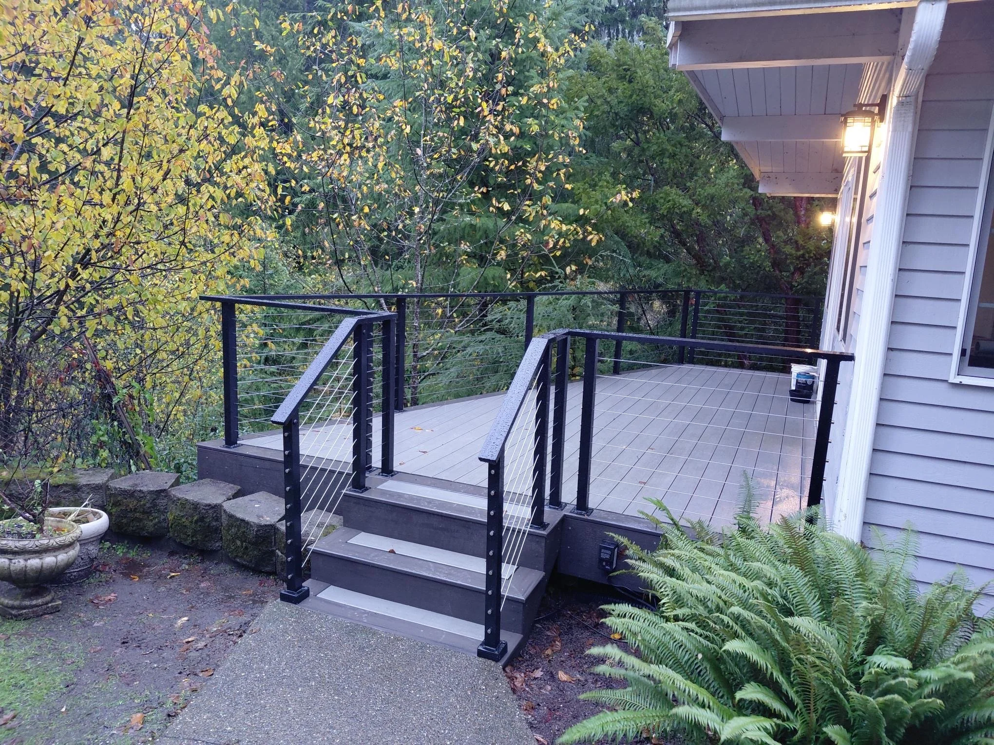 A cozy patio with advanced custom railway features like built in LED lighting.